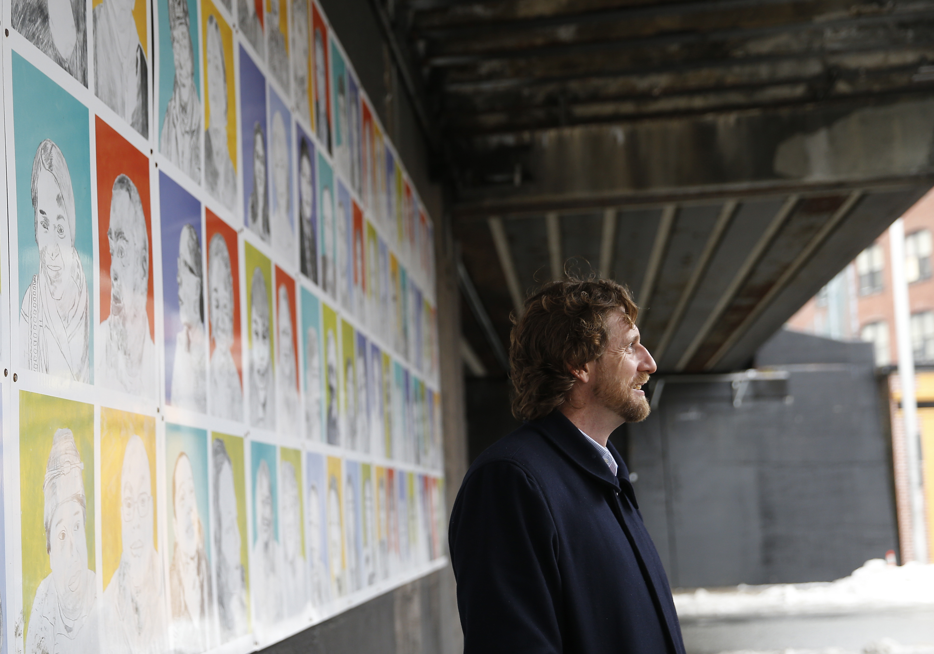 Al Wilson of Beyond Walls underneath an overpass which will be illuminated with multi-colored LED lights to transform the Lynn downtown.