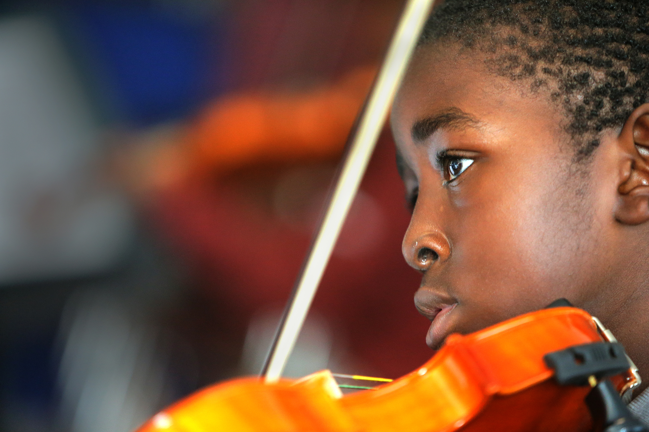 David Ugbe, 9, played his violin in Bridge Boston’s music room.