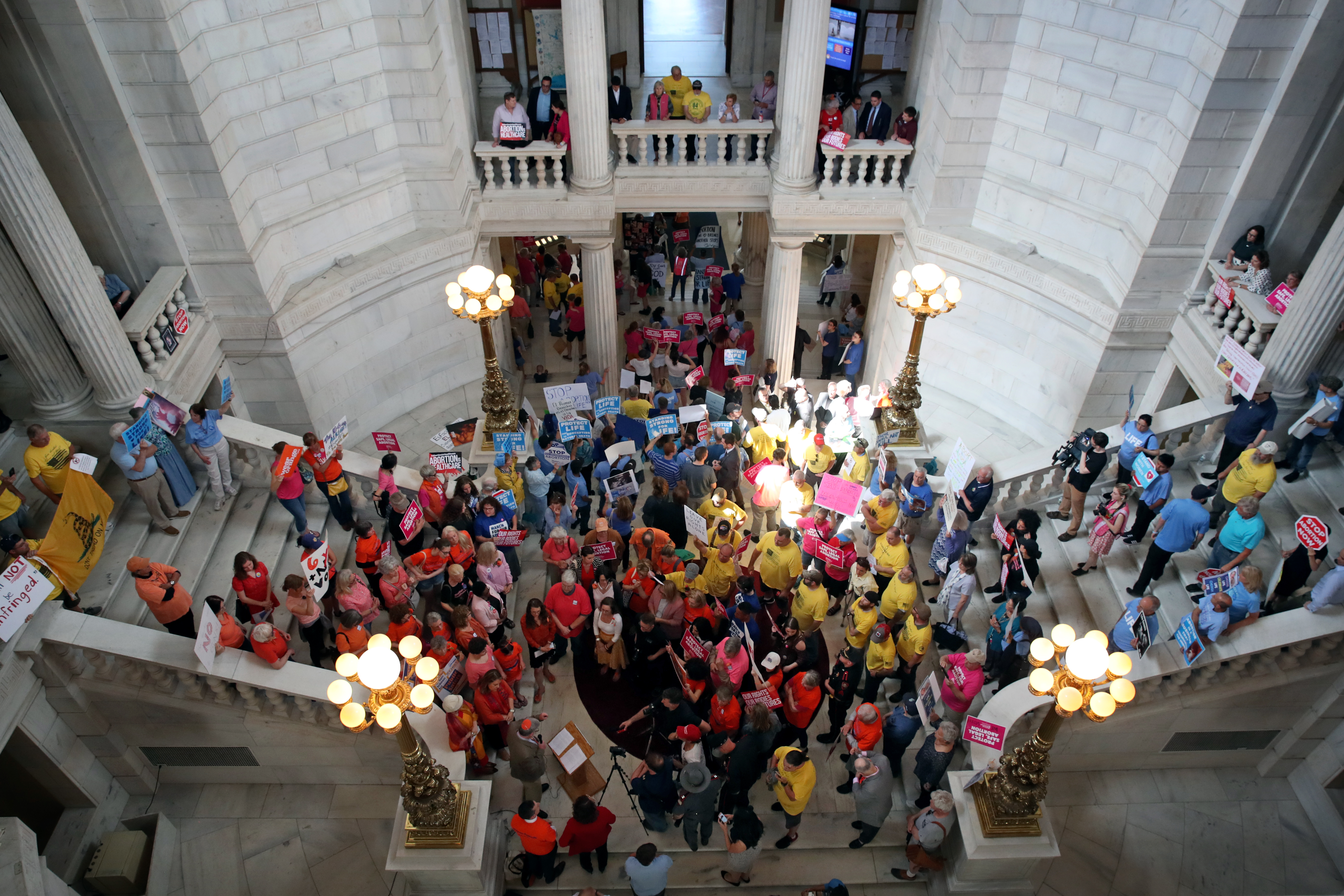 Supporters and opponents of a Rhode Island abortion rights bill gathered in the rotunda of the State House on Tuesday.