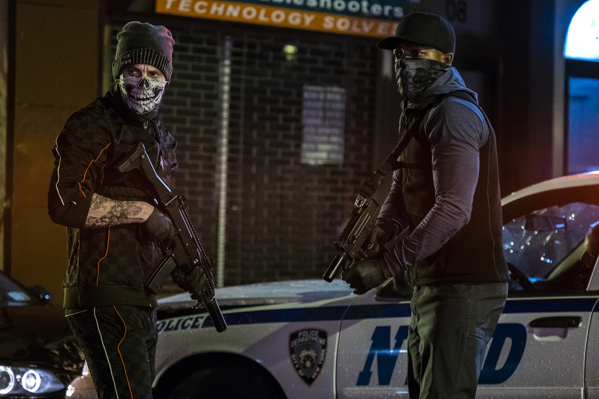 Taylor Kitsch (left) and Stephan James in "21 Bridges."