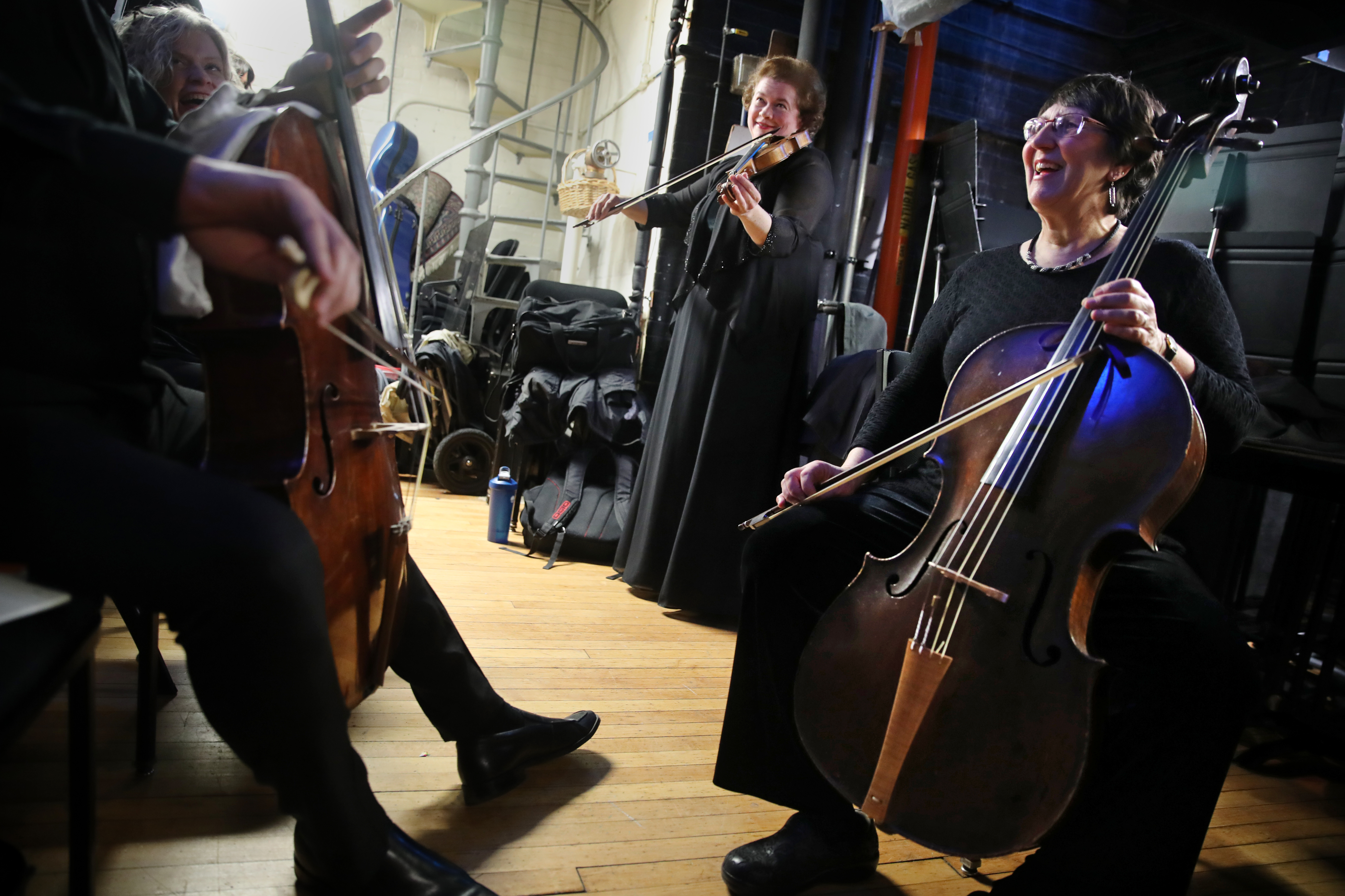 Cellist Sarah Freiberg (right) joined others warming up before their first show of the weekend at Jordan Hall on Friday.