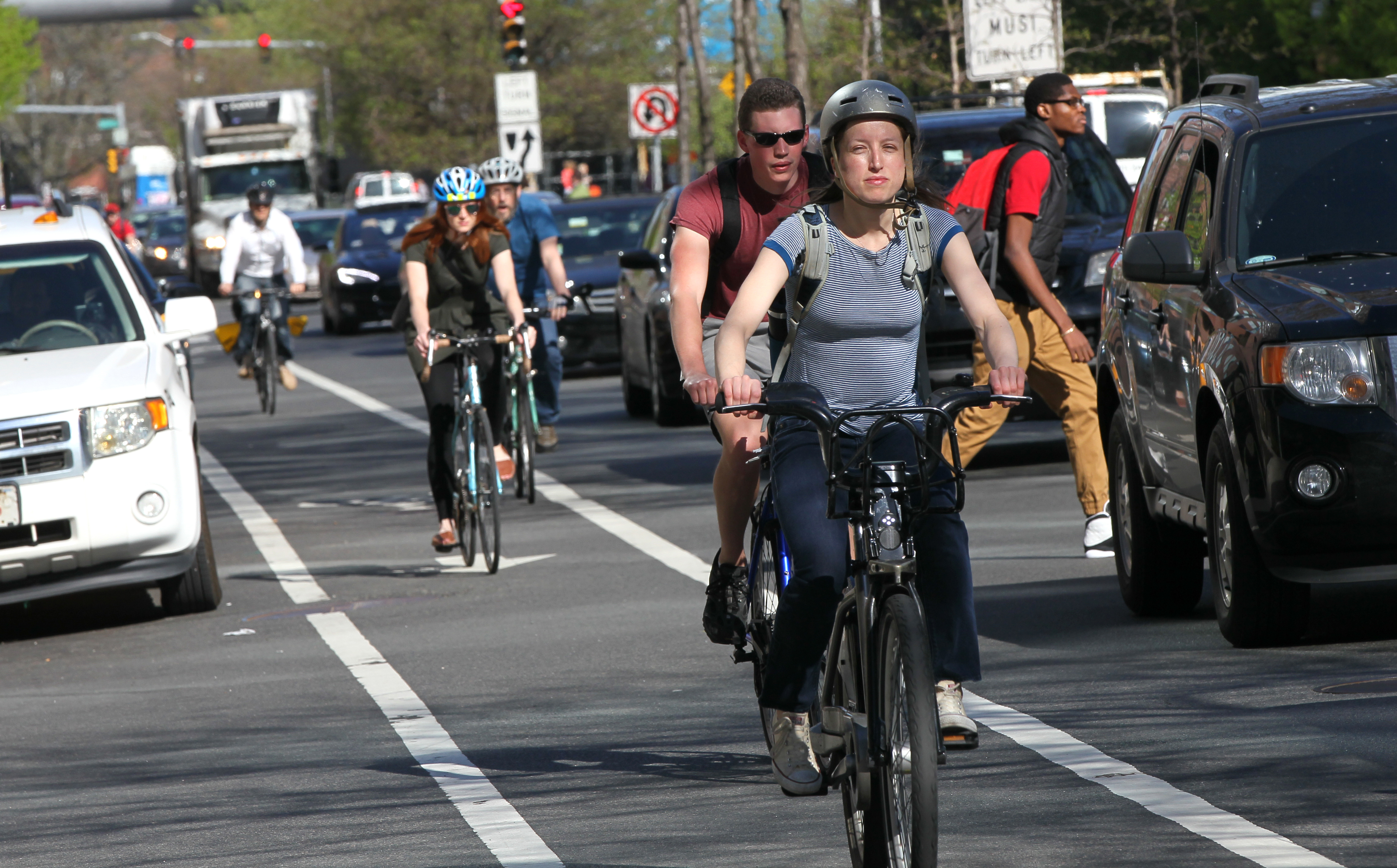 Bike and car commuter traffic on Broadway.