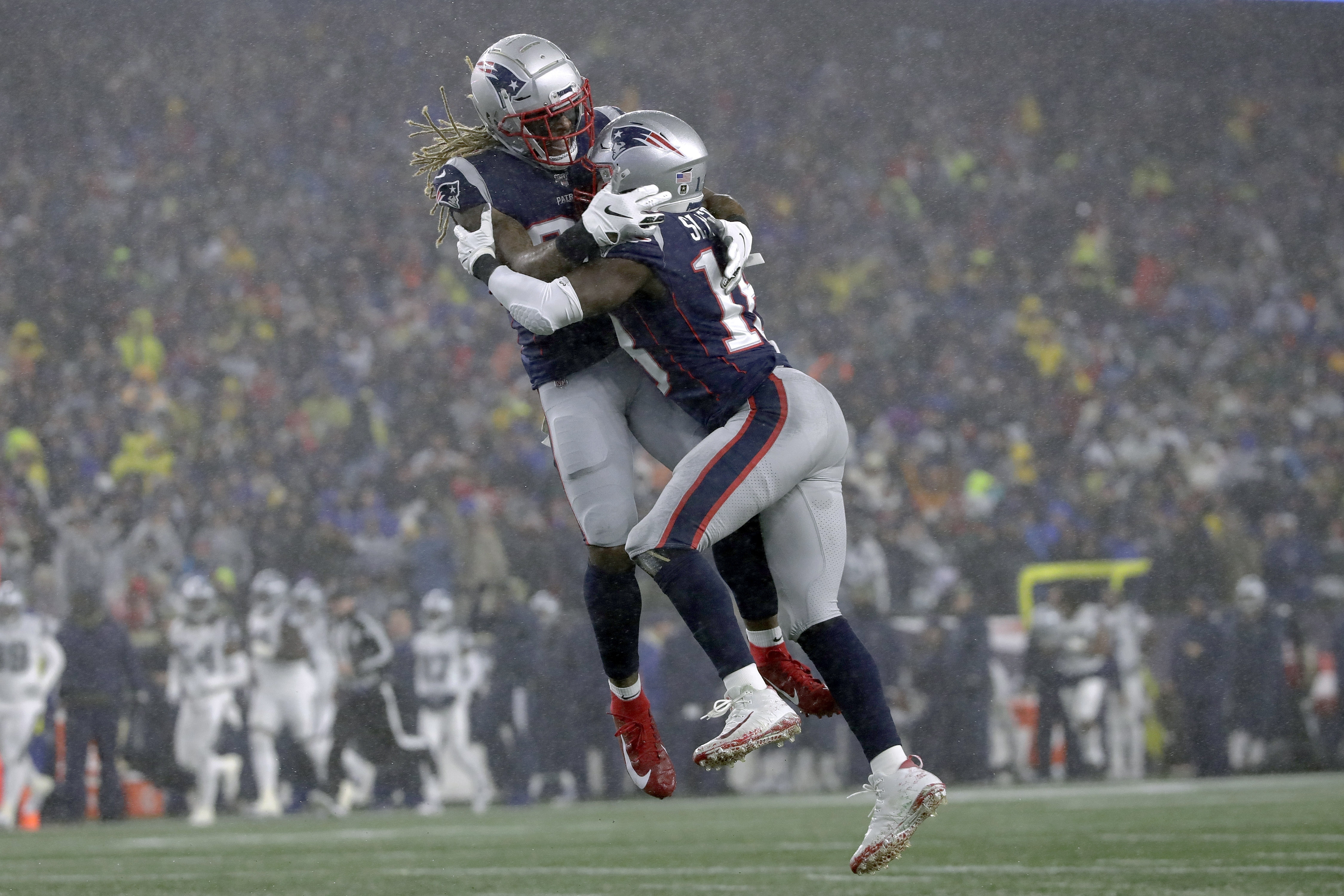 Brandon Bolden (left) and Matthew Slater celebrate Slater’s blocked punt in the first half Sunday vs. the Cowbouys.