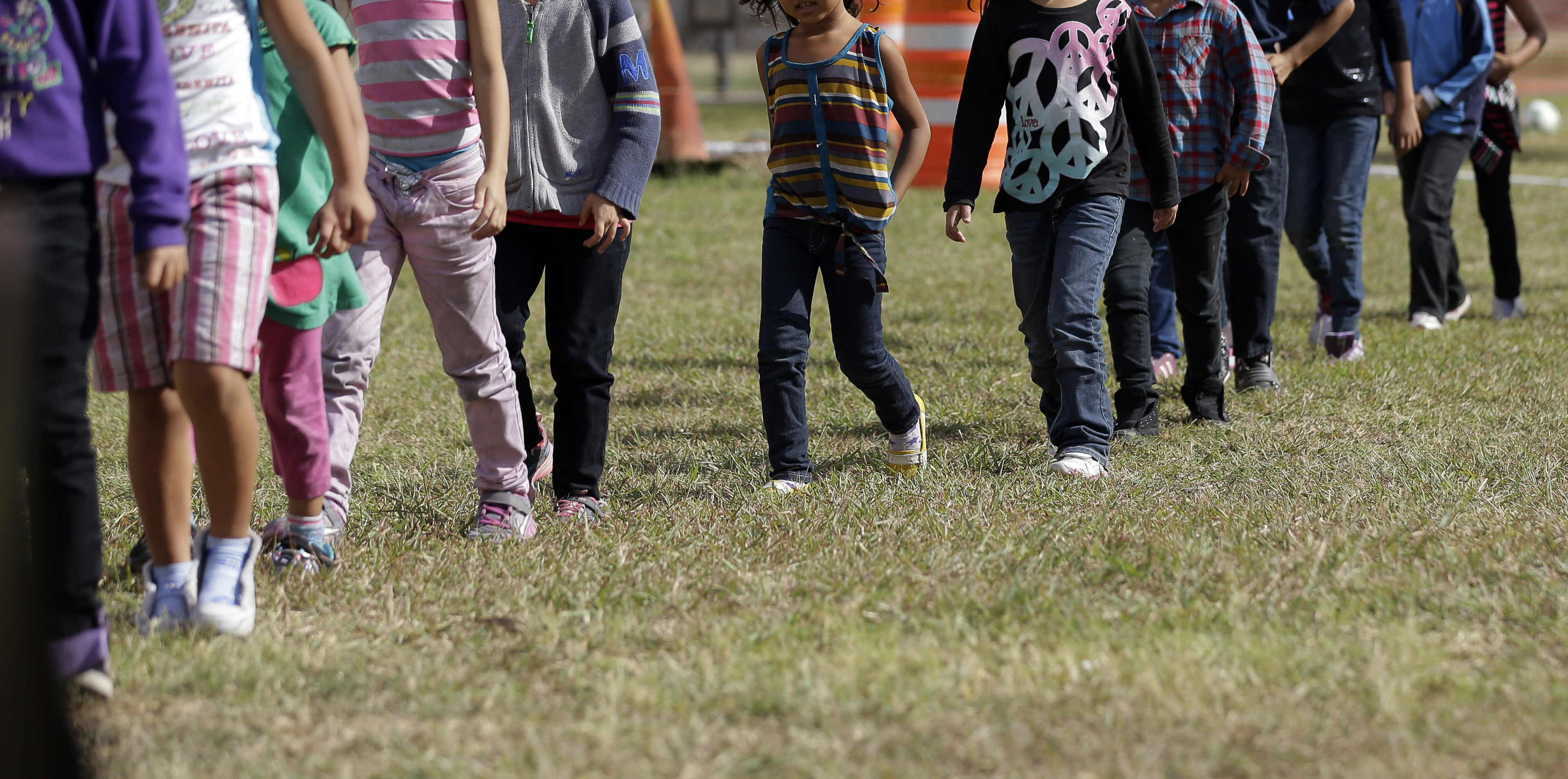 Detainees walked in a line at a US Customs and Border Protection processing facility in Brownsville, Texas.