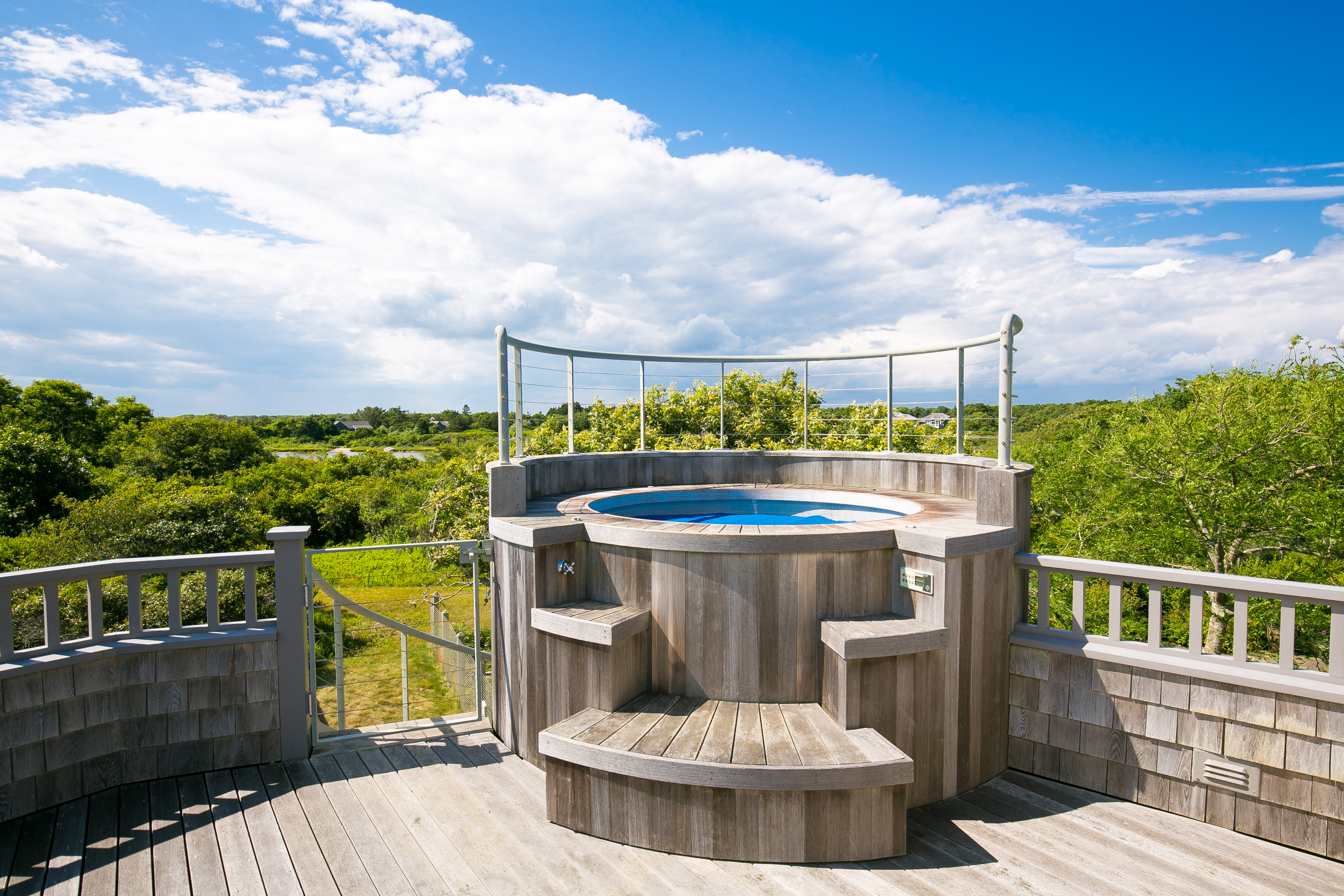 A jacuzzi on a second-floor balcony.