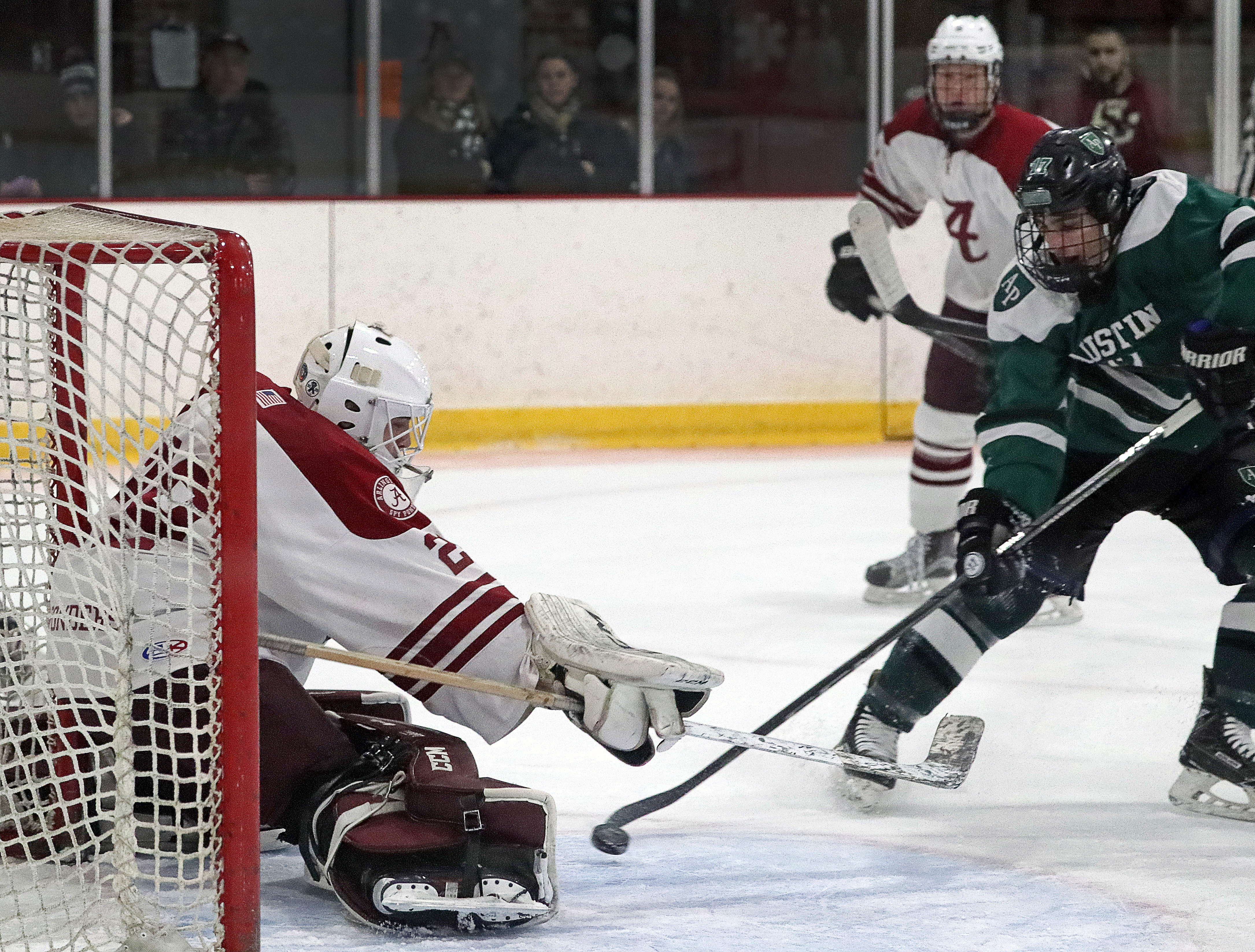 Anthony Cafarelli (17) gives Austin Prep a 1-0 lead after he scores on Arlington goalie Jack Pinard (29) at 10:07 of the first period.