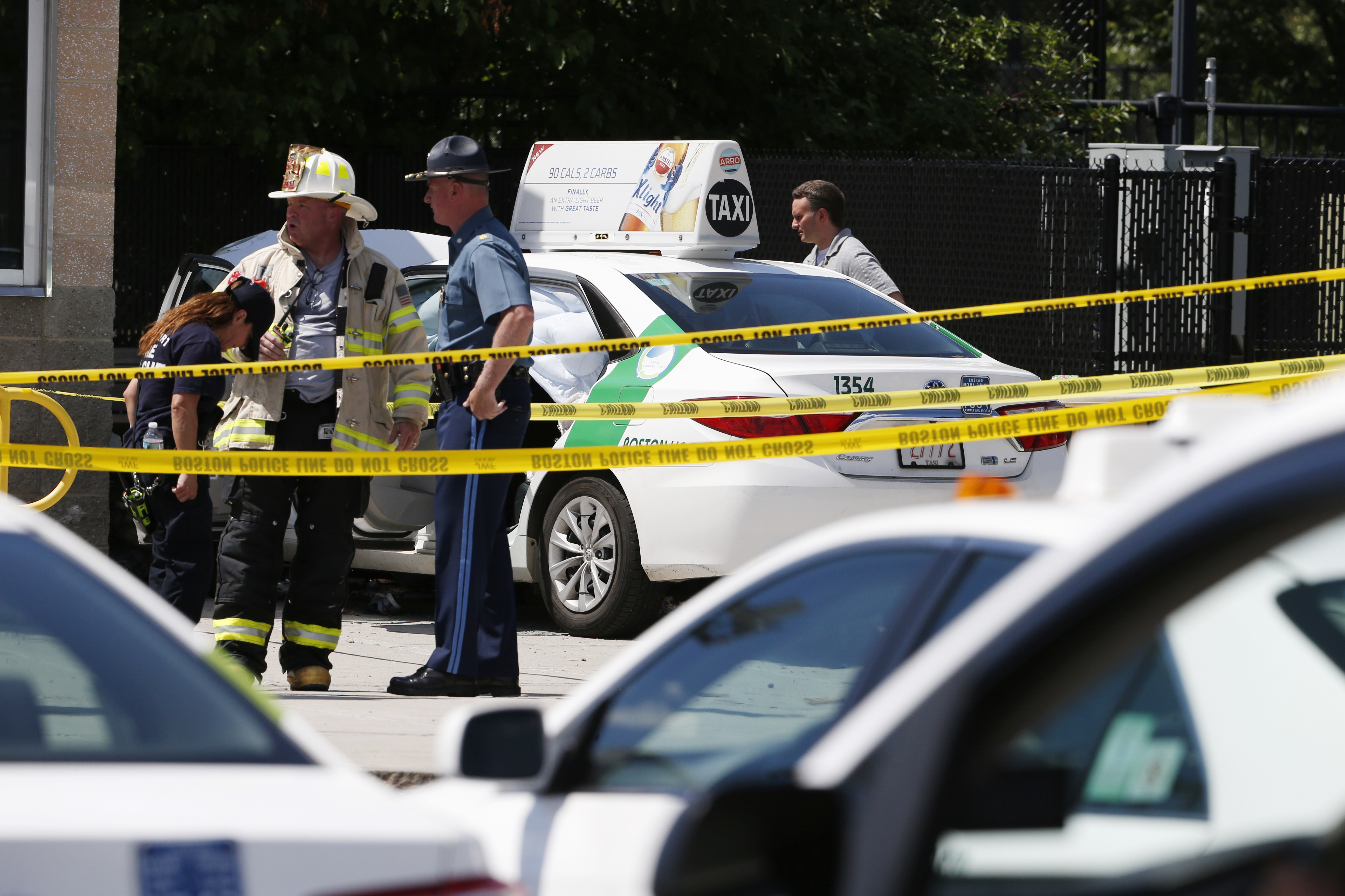 Emergency personnel stood near the cab involved.