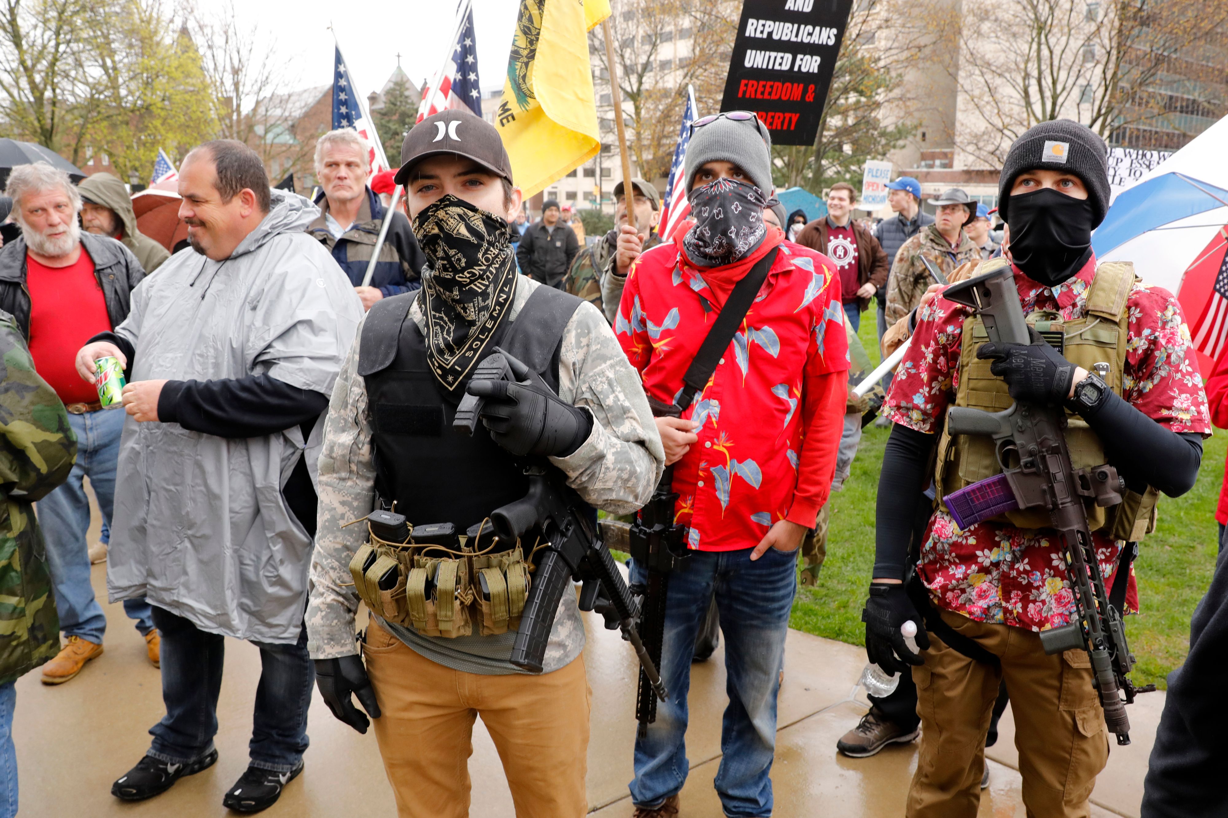 Demonstrators take part in an "American Patriot Rally" last week, organized by Michigan United for Liberty on the steps of the Michigan State Capitol in Lansing, demanding the reopening of businesses.