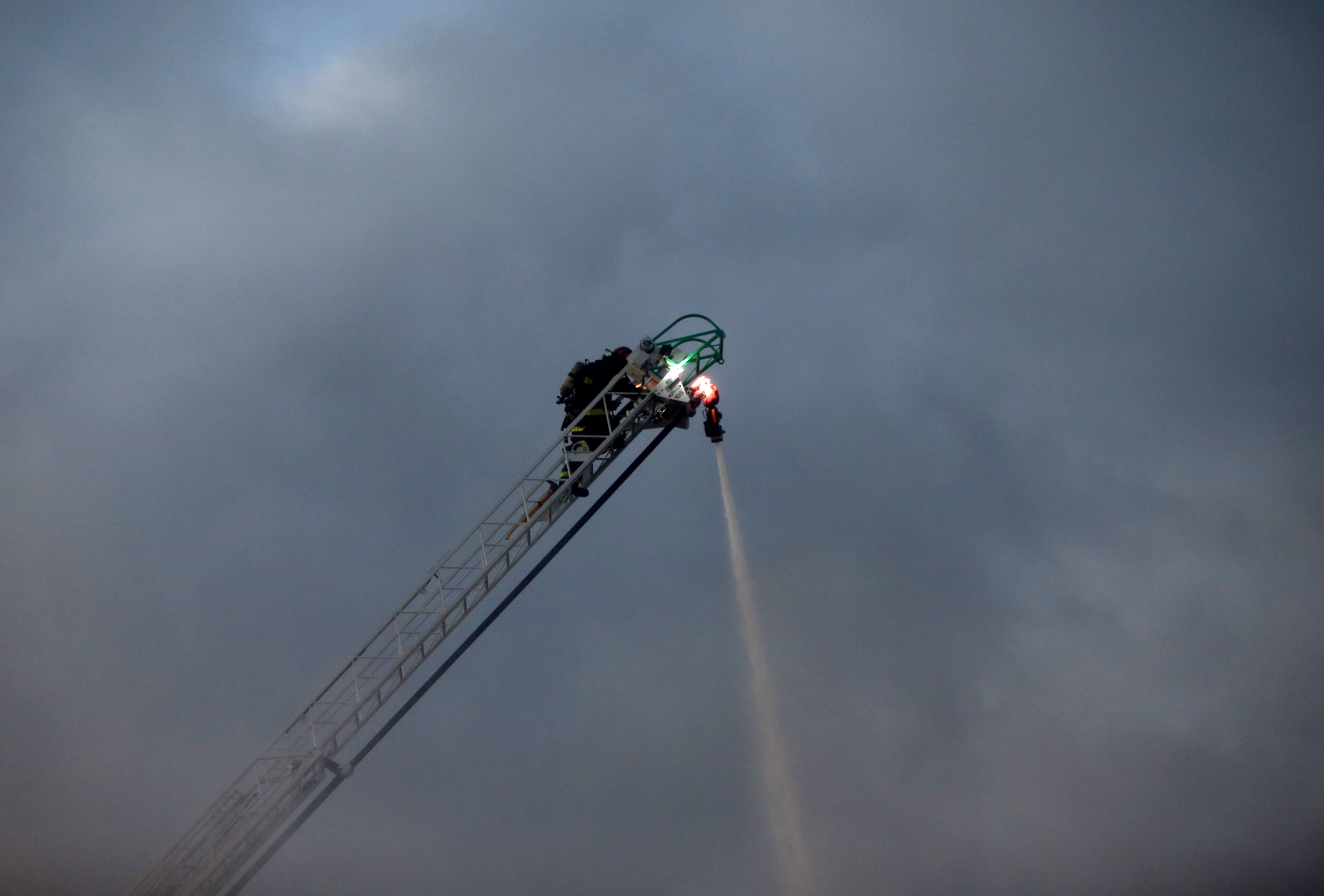 Firefighters poured water on the fire.