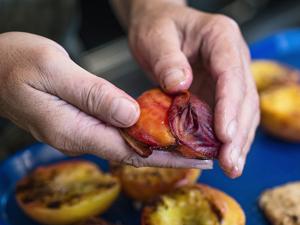 Tip: Skin slips from grilled peach halves effortlessly. Just use your fingers to push it off the flesh.