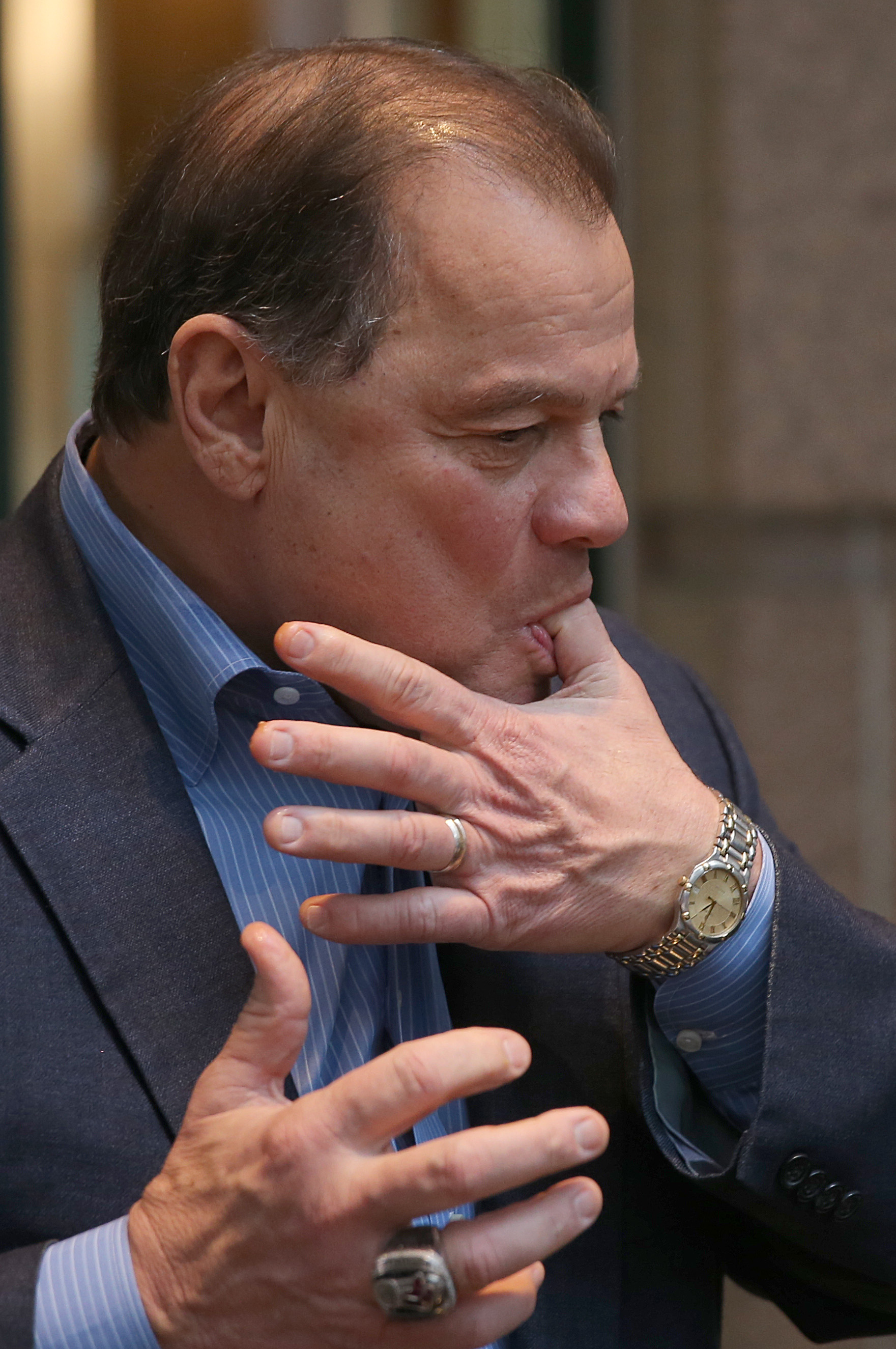 Former Senate President Robert Travaligni samples the doughnuts.