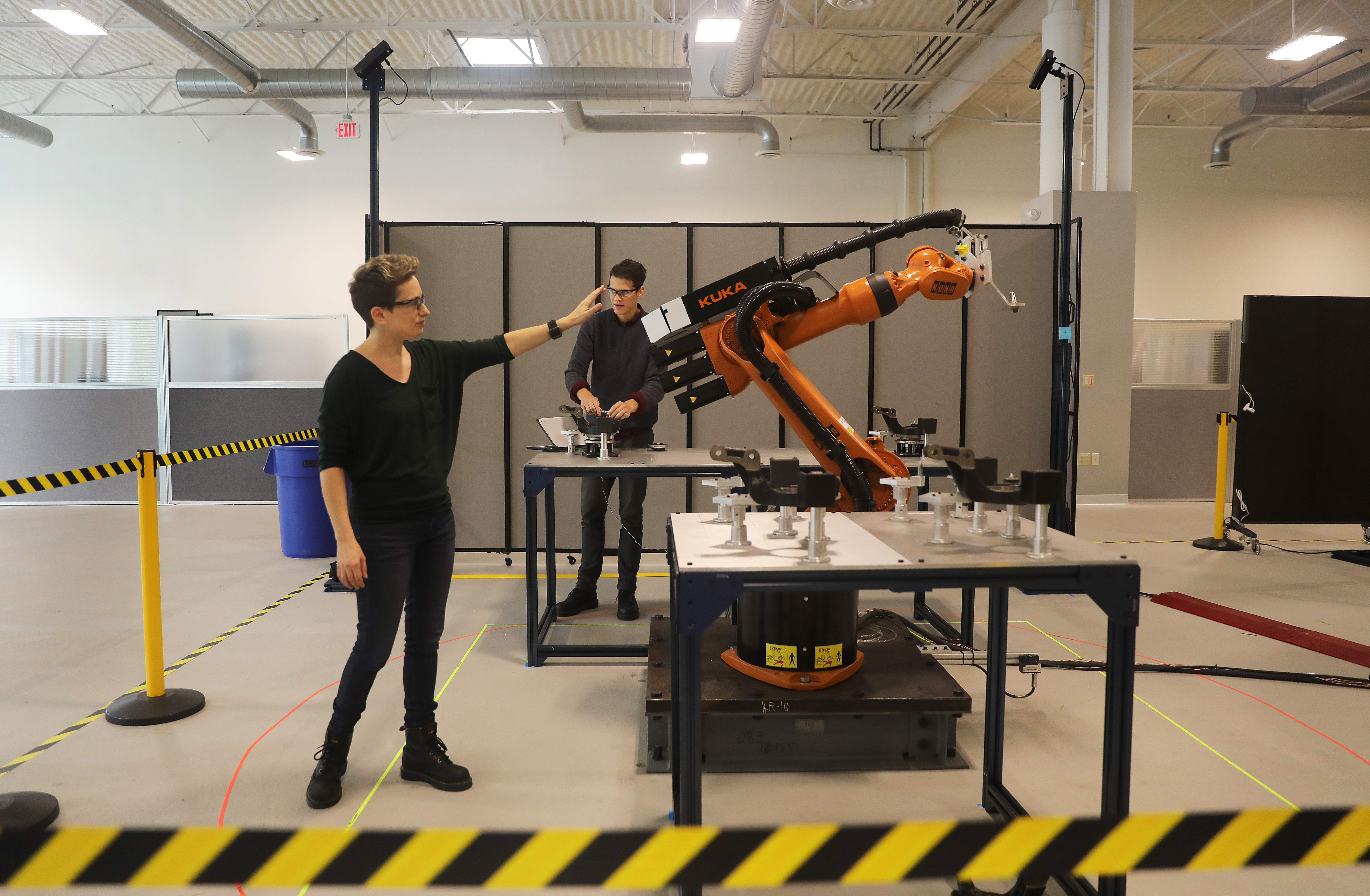 Clara Vu, of Veo Robotics Inc. in Waltham, showed how industrial robots can work with people. At rear is engineer Paul Schroeder.