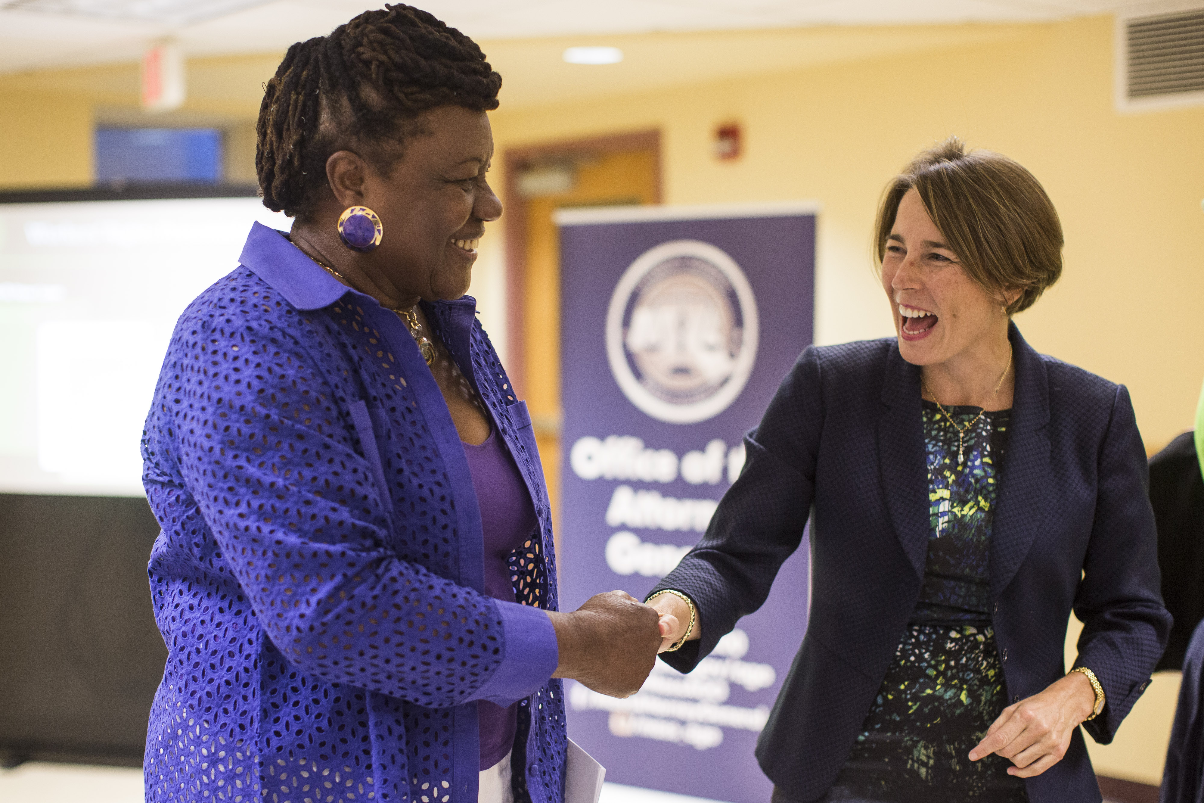 Healey spoke to Dorchester resident Gertrude Delsoin during a community outreach hour.