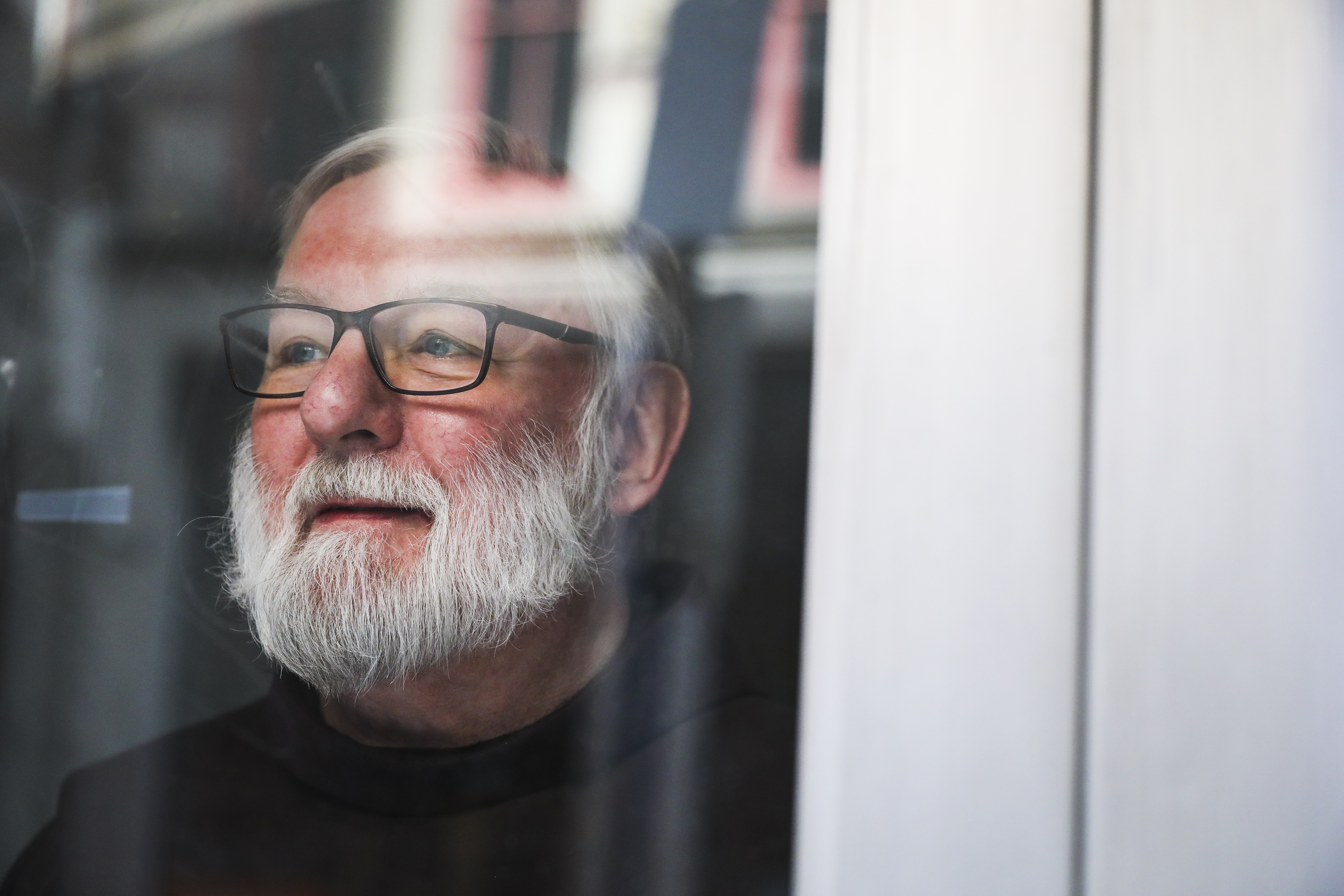 Father Richard Flaherty stood behind a door at the St. Anthony Shrine in Boston.