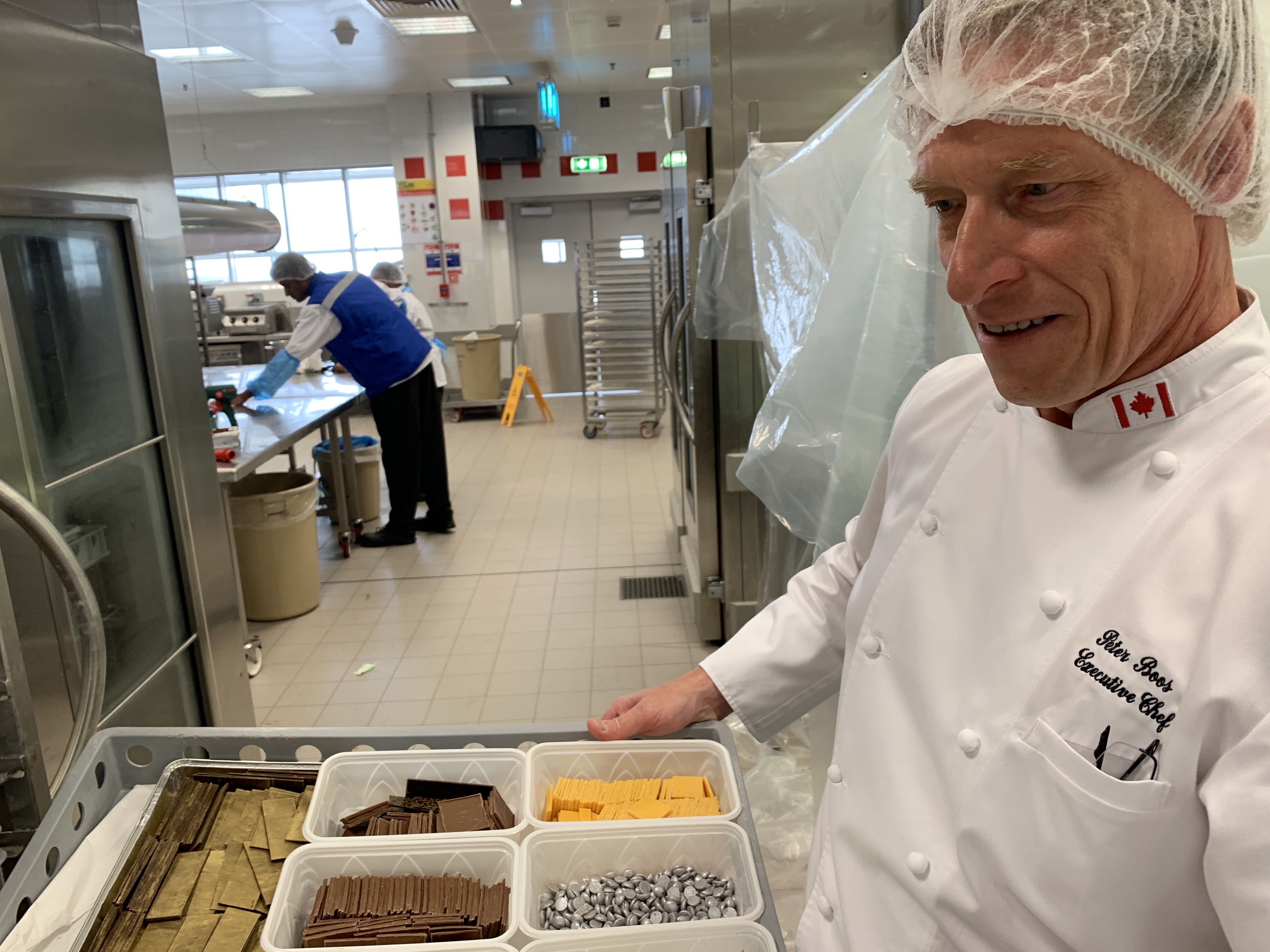 Peter Boos, executive chef for Emirates, shows some of the decorative toppings used for desserts at the airline’s headquaters in Dubai.