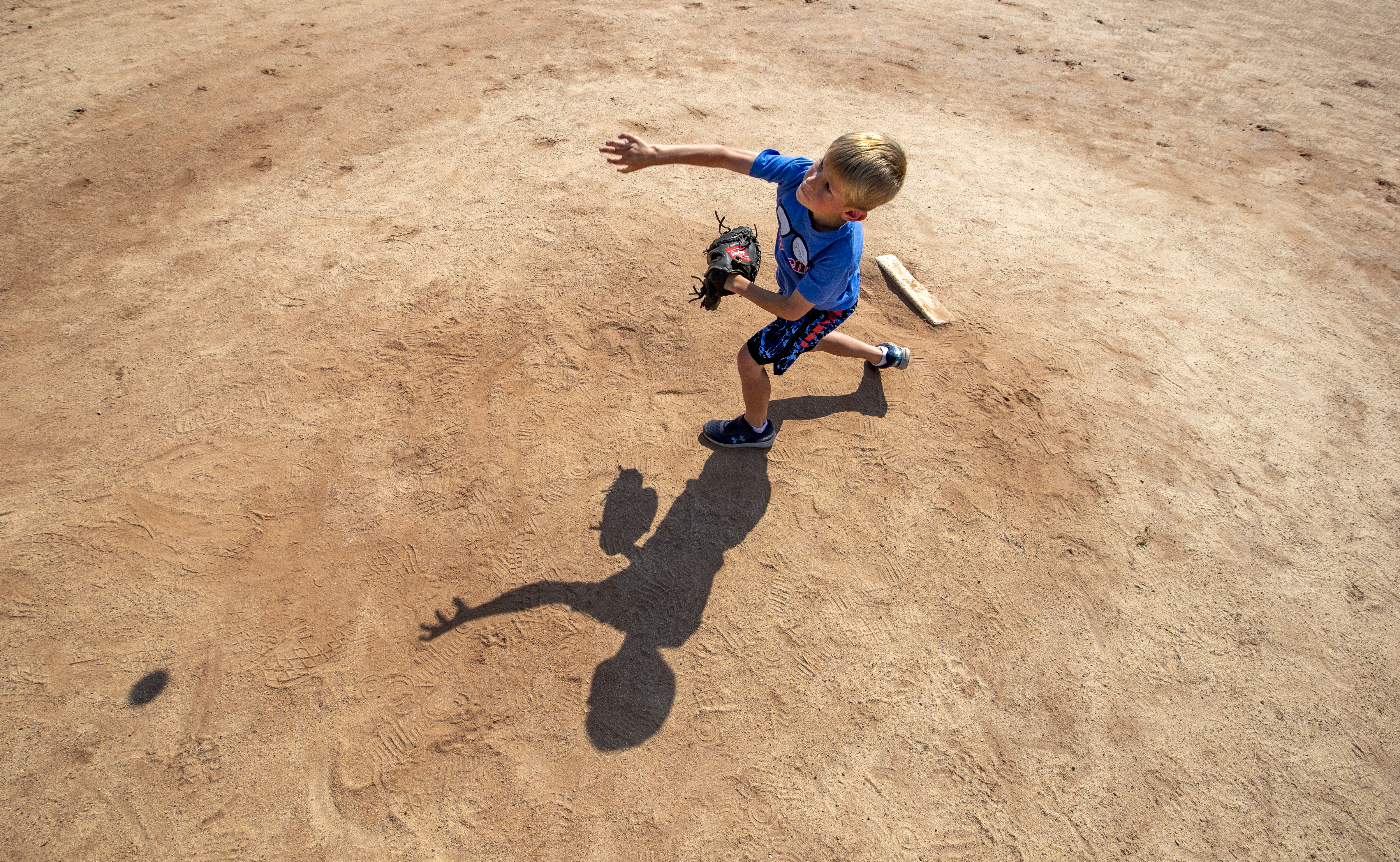 Brady O’Connor, 7, pitches to his grandmother in McConnell Park in Dorchester.