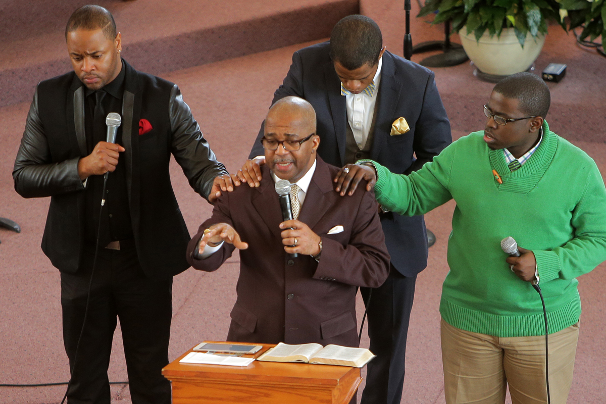 Bishop John M. Borders III spoke about violence during the Sunday service at Morning Star Baptist Church. He asked men in attendance to come forward for prayer.