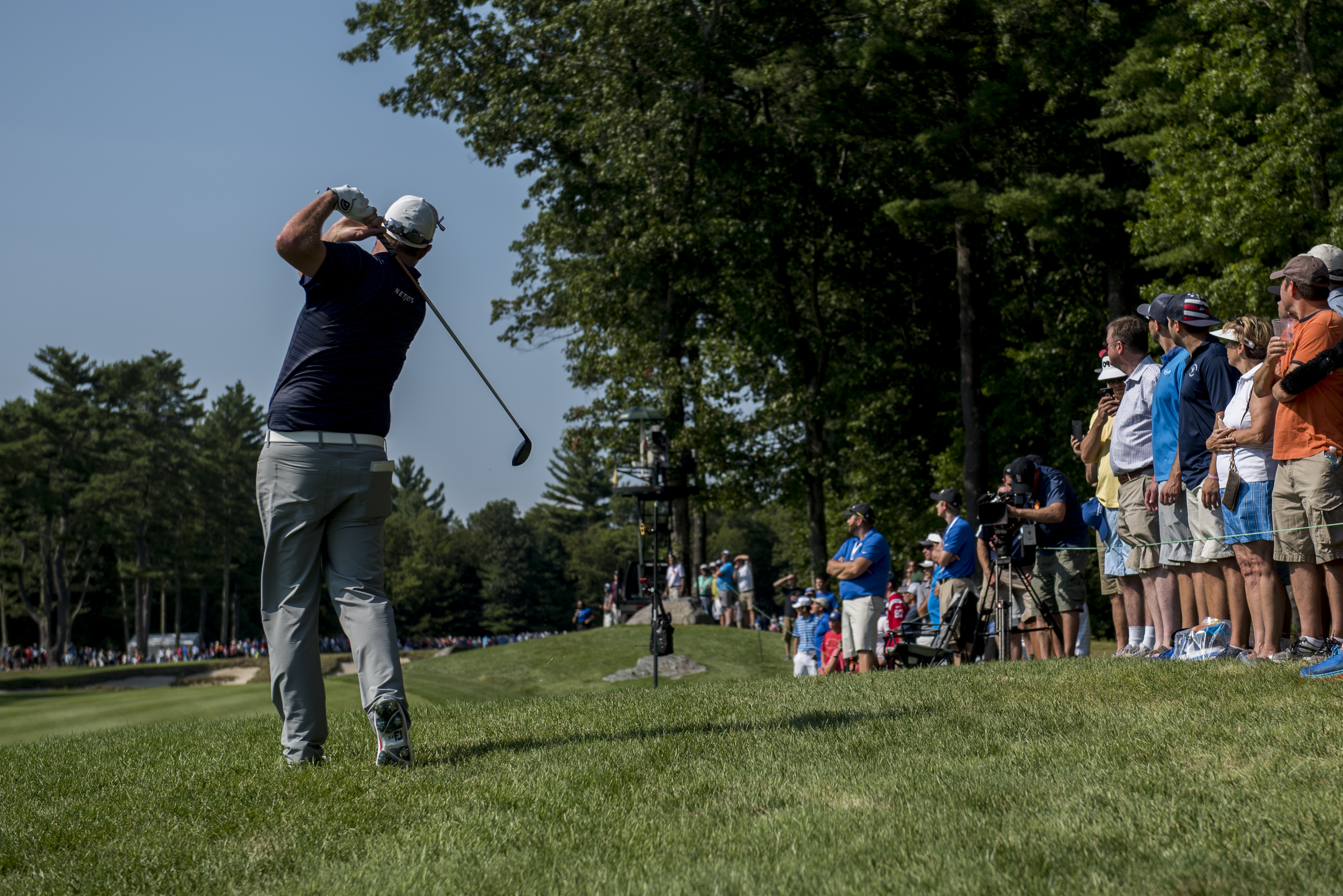 Leishman plays from the rough on No. 7.