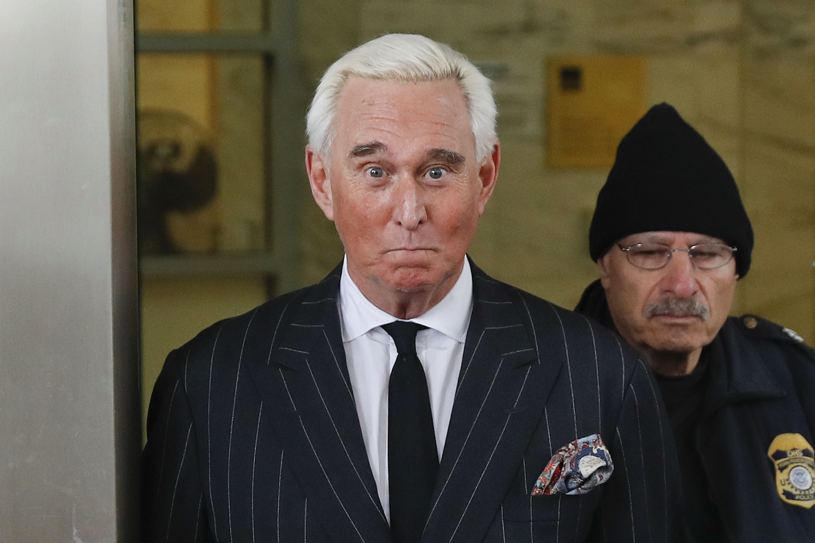 Roger Stone, former campaign adviser for President Donald Trump, leaves federal court in Washington in February. The Justice Department said Tuesday it will take the extraordinary step of lowering the amount of prison time it will seek for Roger Stone, an announcement that came just hours after President Donald Trump complained that the recommended sentence for his longtime ally and confidant was “very horrible and unfair."
