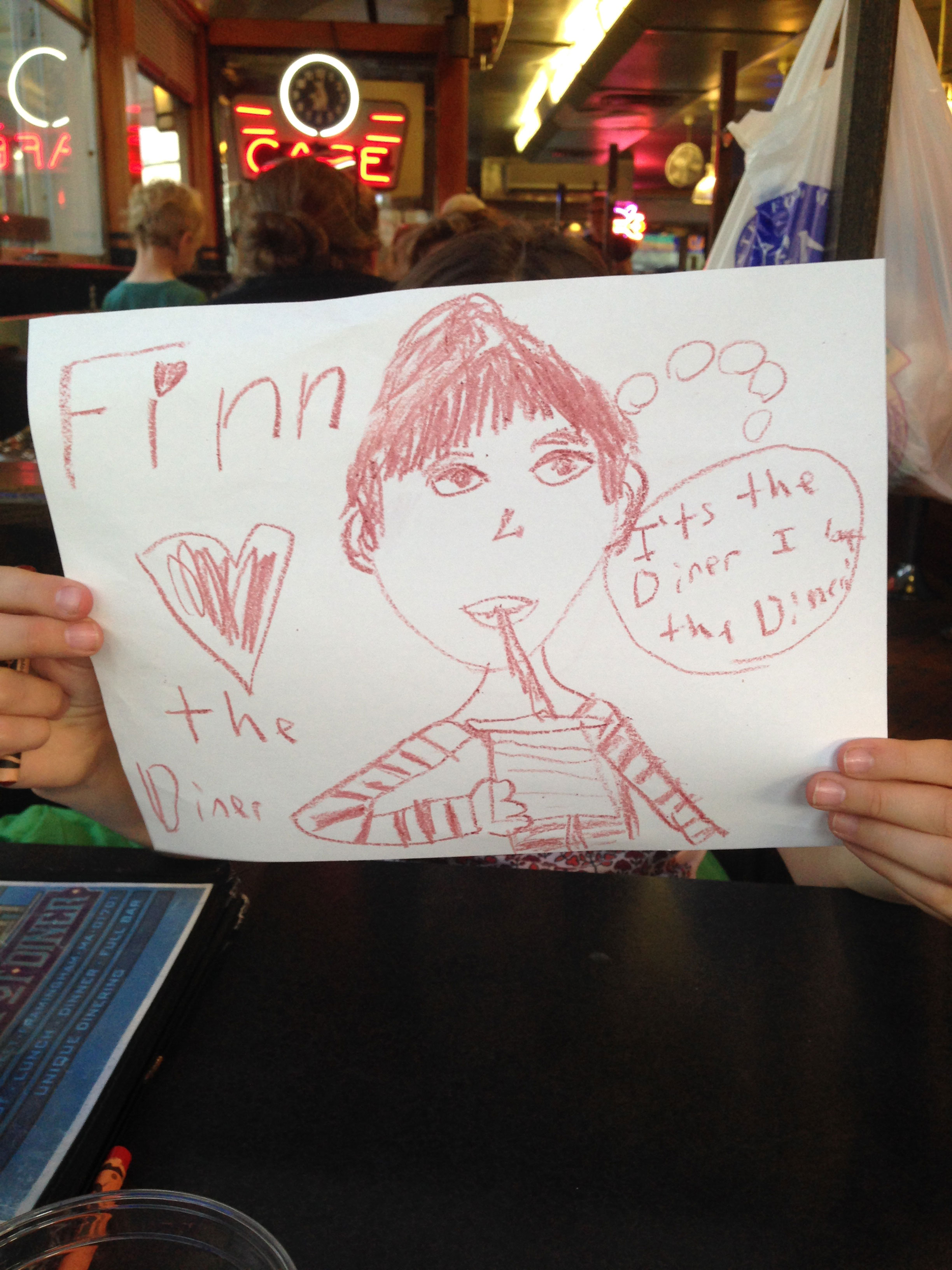 Annabel’s drawing of Finn enjoying the diner.