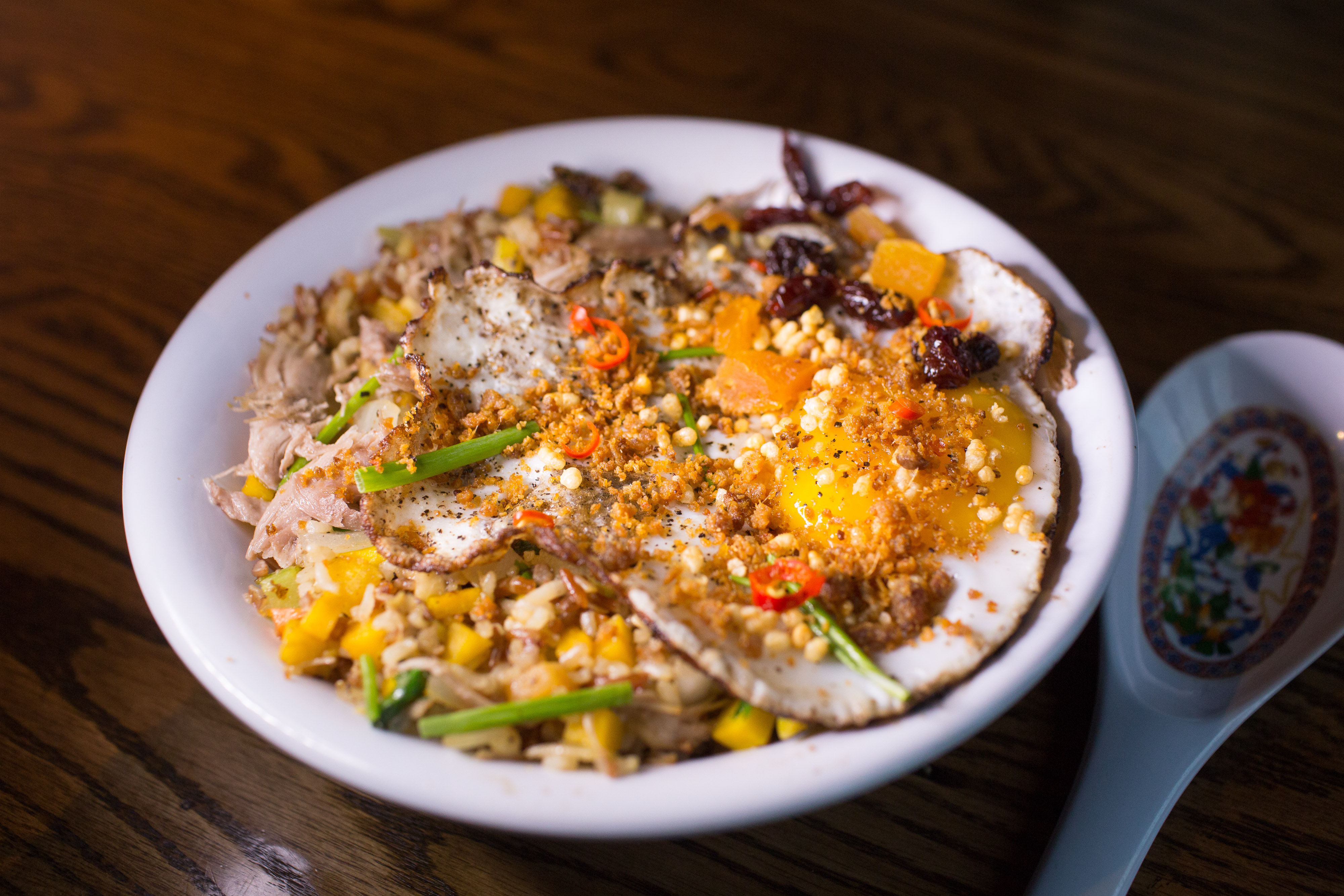 At Blue Dragon, duck confit fried rice with pumpkin mirepoix and duck egg.