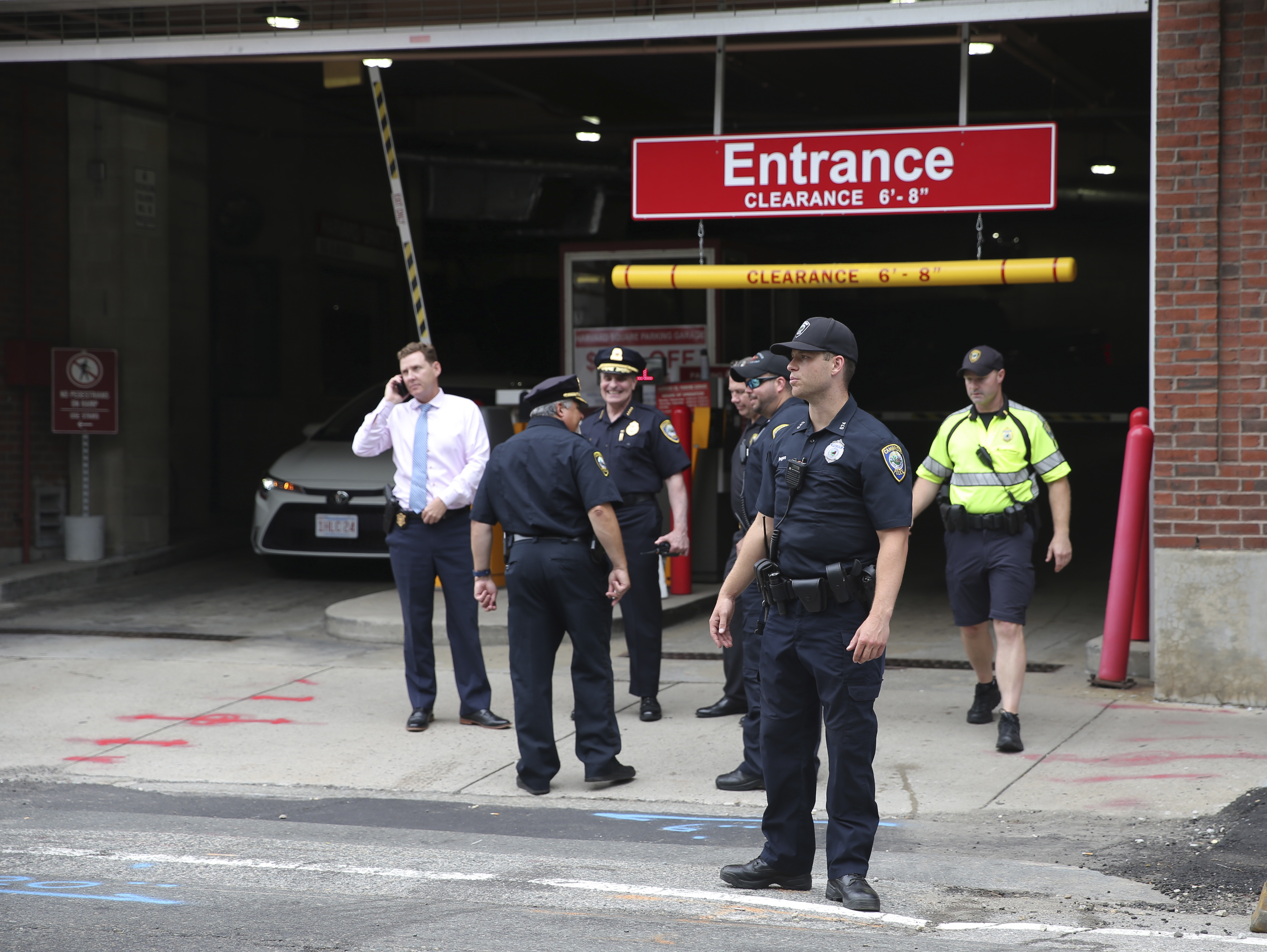 Police stood outside a Harvard Square garage Tuesday shortly after the suspect was apprehended.