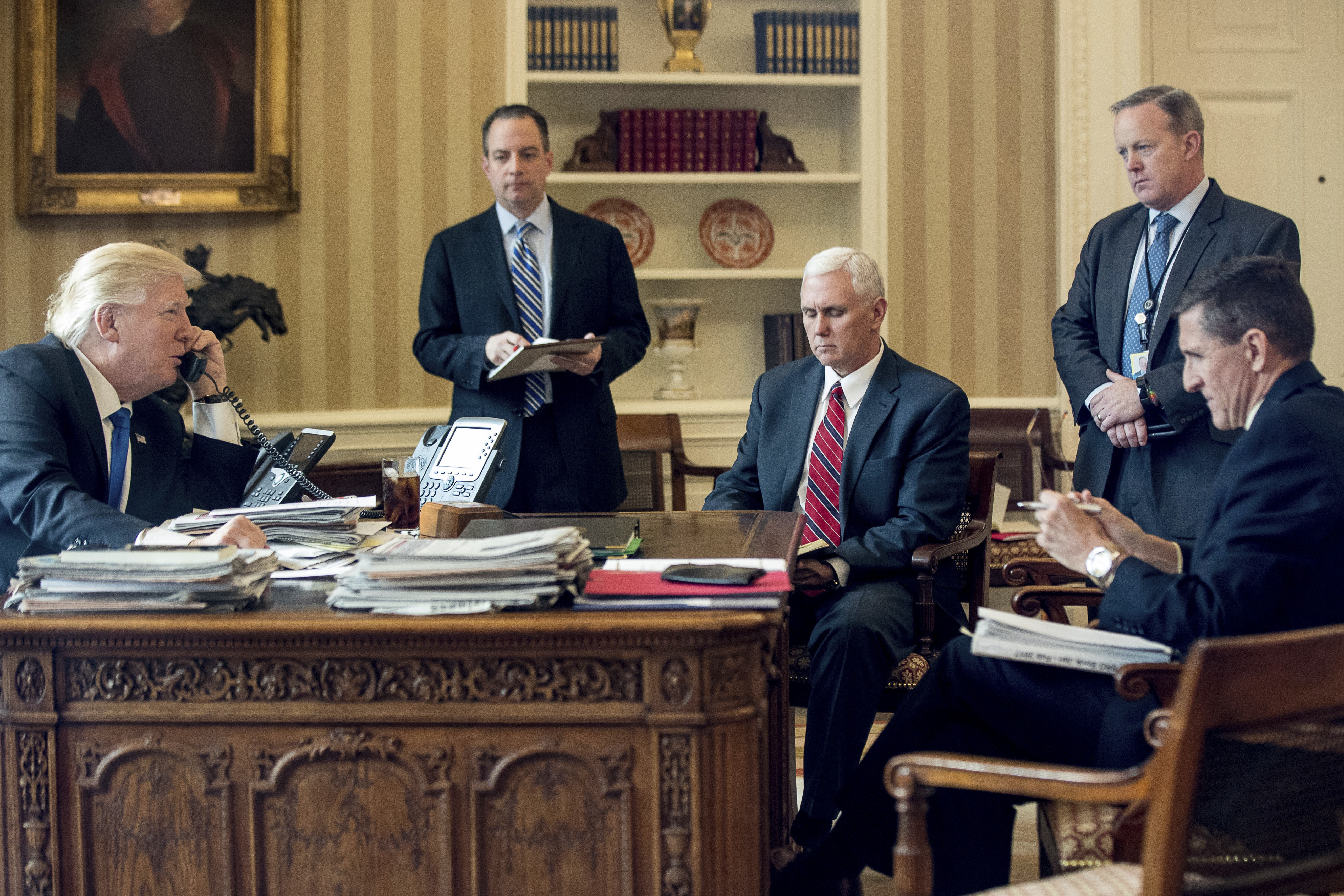 President Trump was accompanied by (from left) Chief of Staff Reince Priebus, Vice Prsident Mike Pence, press secretary Sean Spicer and Flynn on Jan. 28 during a phone call with Vladimir Putin.