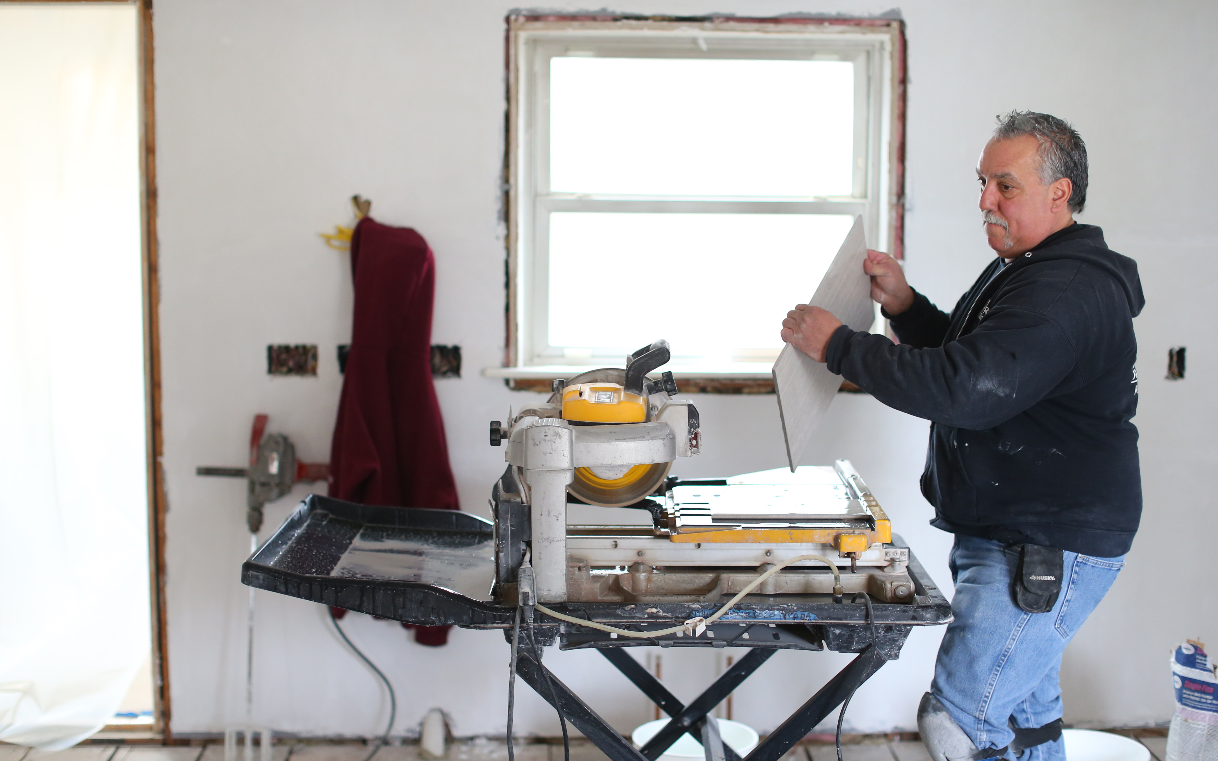 Bobby Murgo Sr. of Murgo Floor Covering Tile started renovation work at a Belmont home.