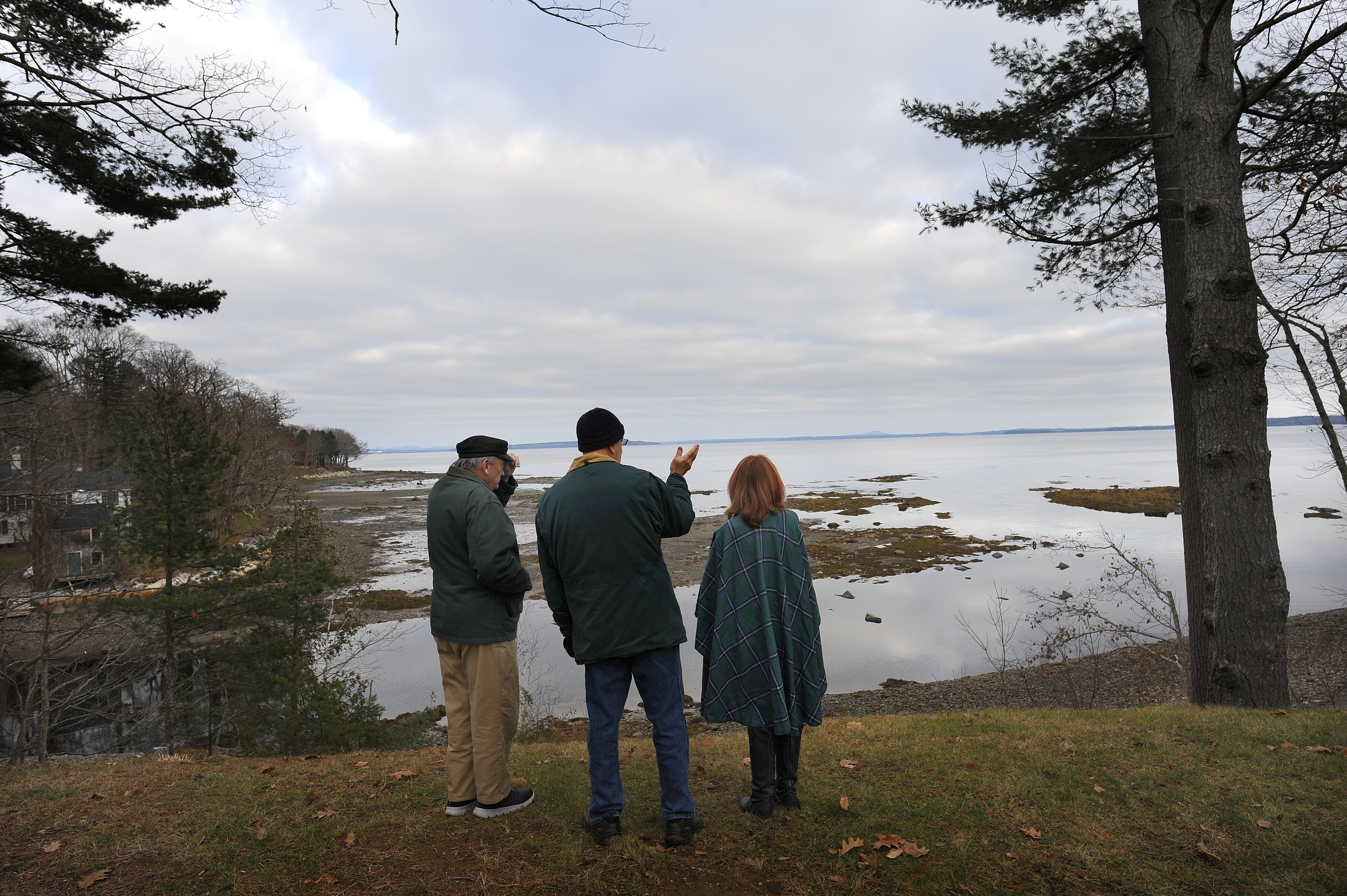From left to right: Maine residents, Sid Block, Dave Losee and Kim Ervin Tucker looked at the area where they are concerned about a massive amount of polluted water that could be discharged into Maine’s Penobscot Bay.