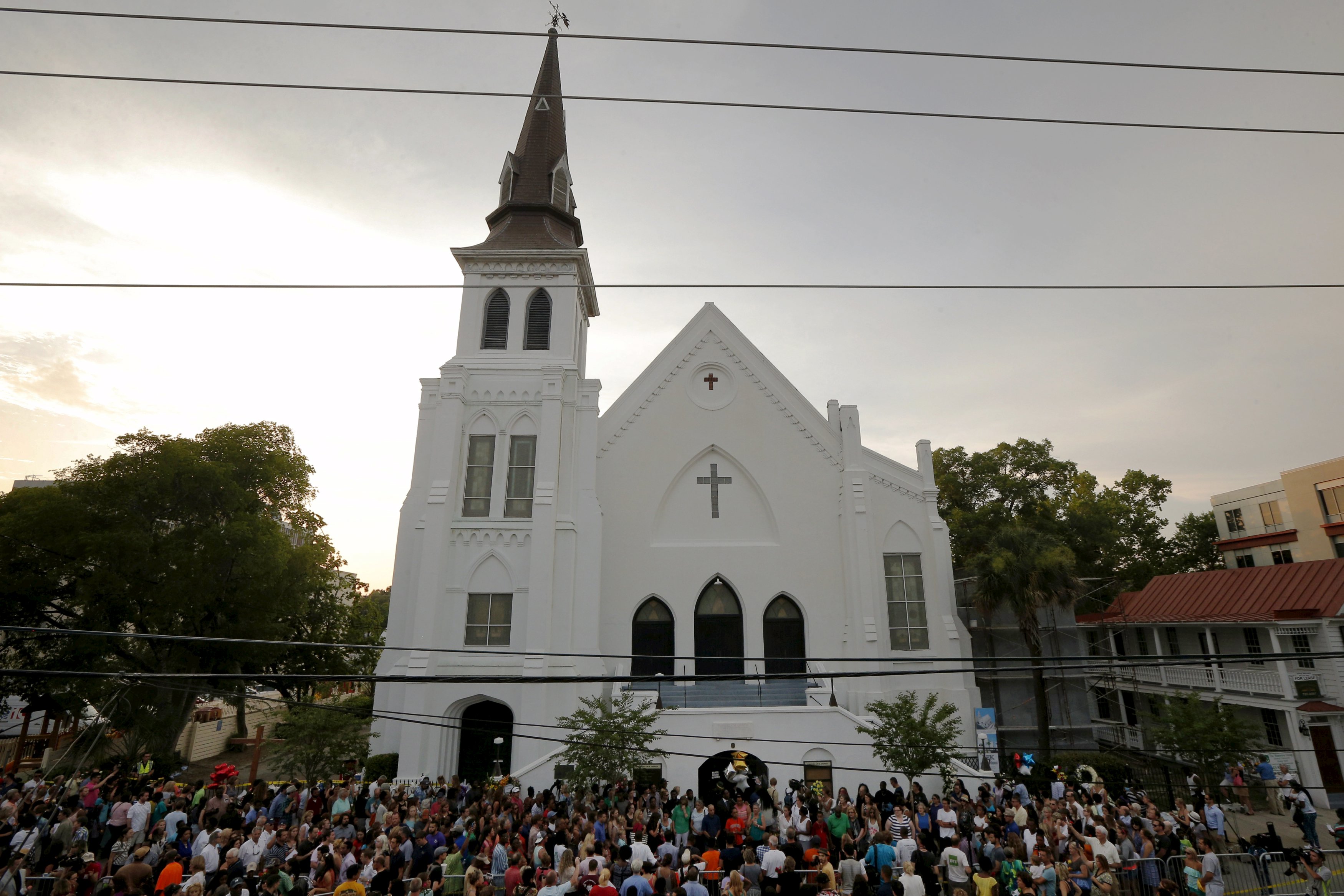 A crowd gathered outside the Emanuel AME Church following a prayer vigil nearby.