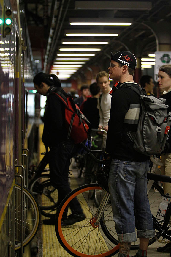 A midnight marathon rider waited with his bicycle to board the commuter line toward Hopkinton in 2012.