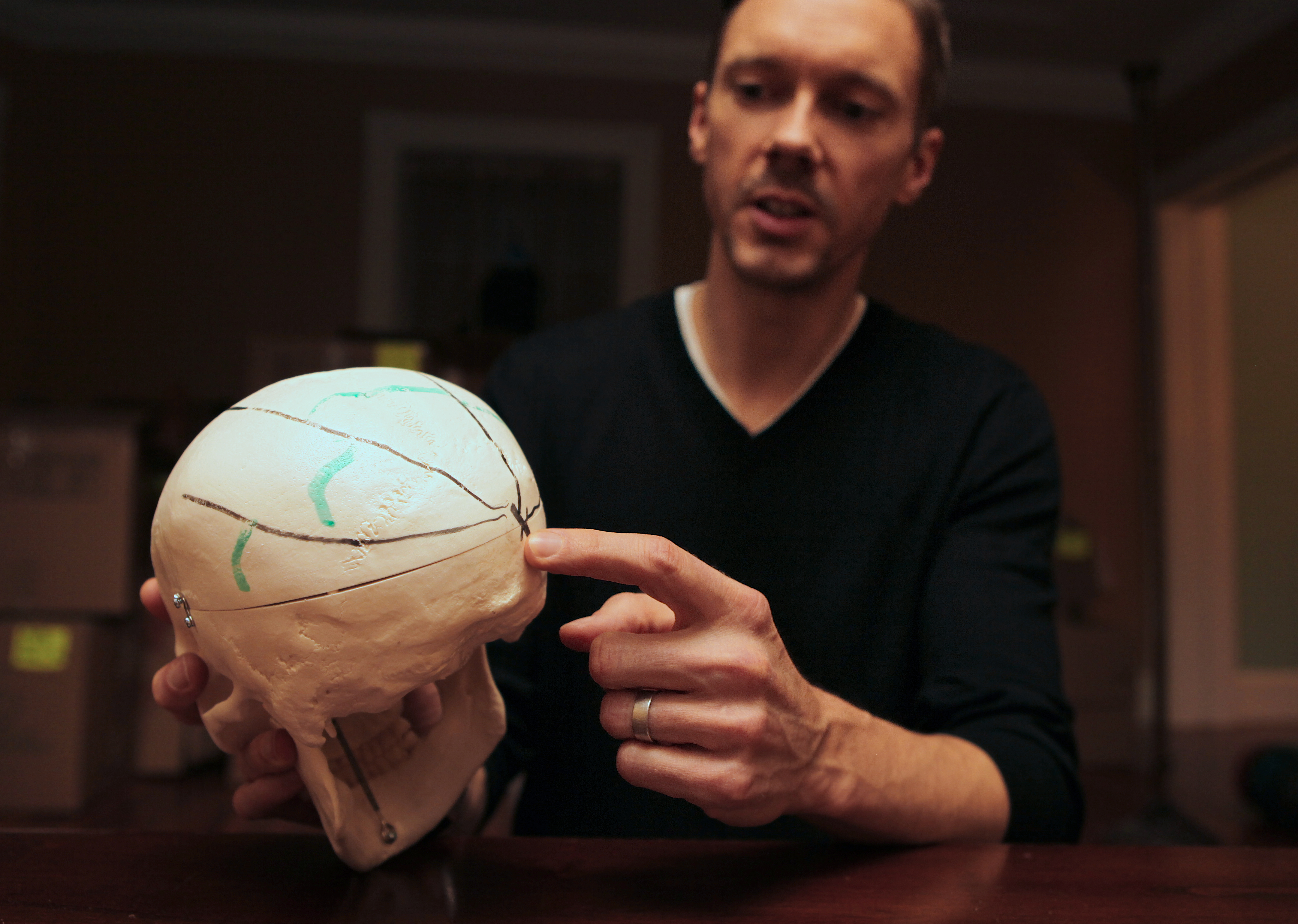Dr. Peter Cummings, a forensic neuro-pathologist, shown in 2013 explaining some of his work.