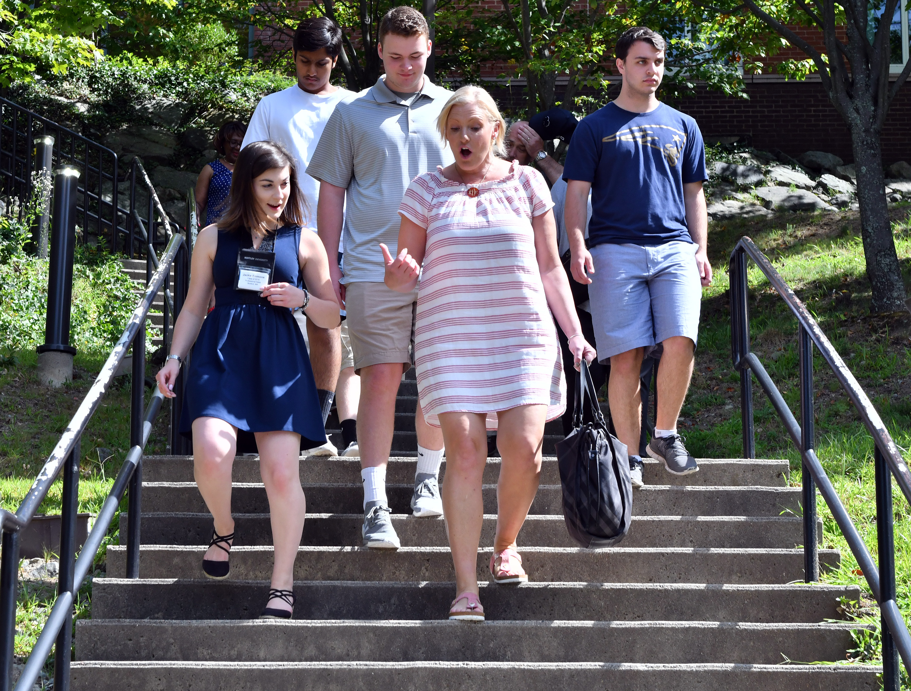 Emmons (left) spoke with the mother of a prospective Bentley University student during a campus tour.