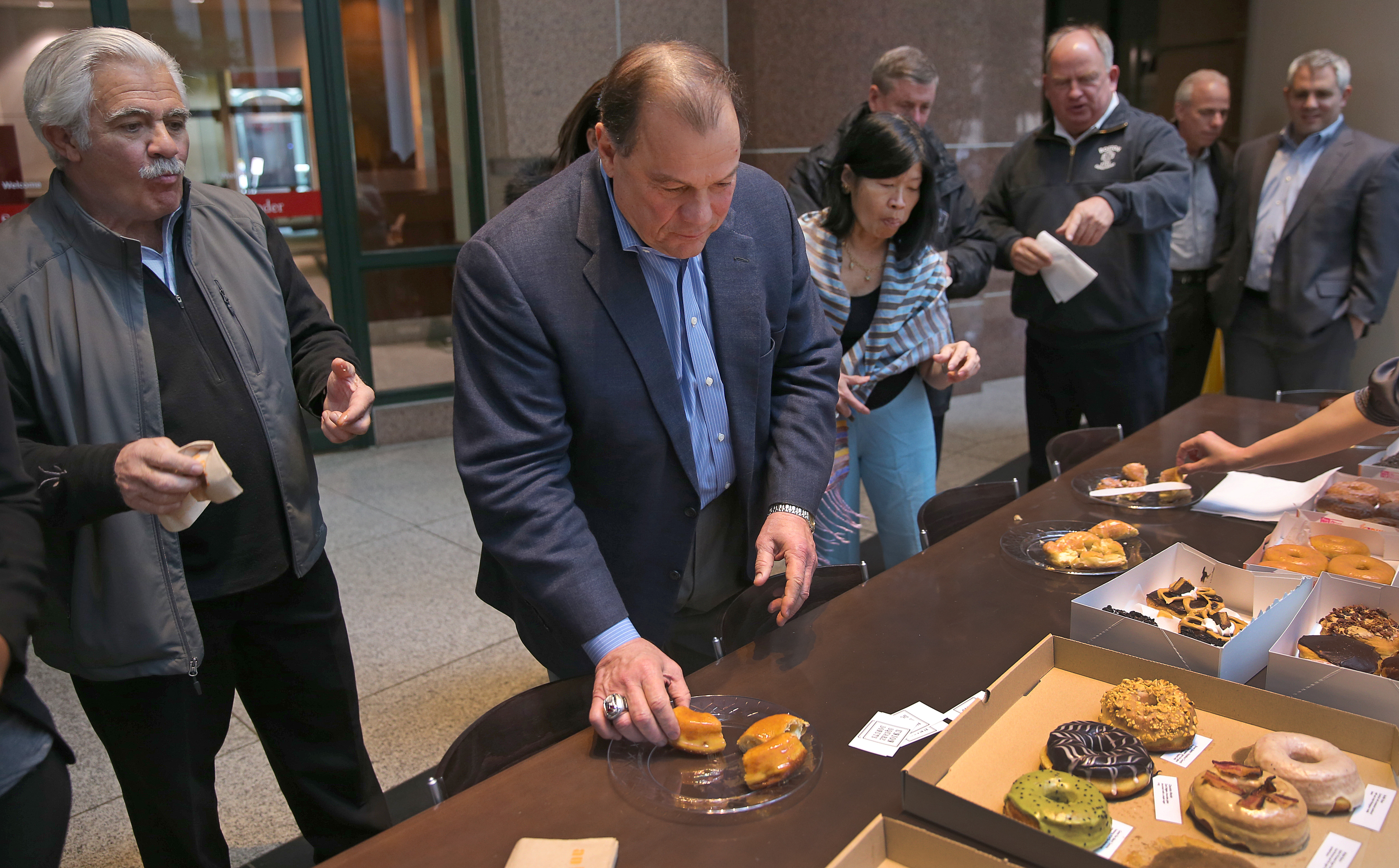 Taste testers line up to try the doughnuts at International Place.