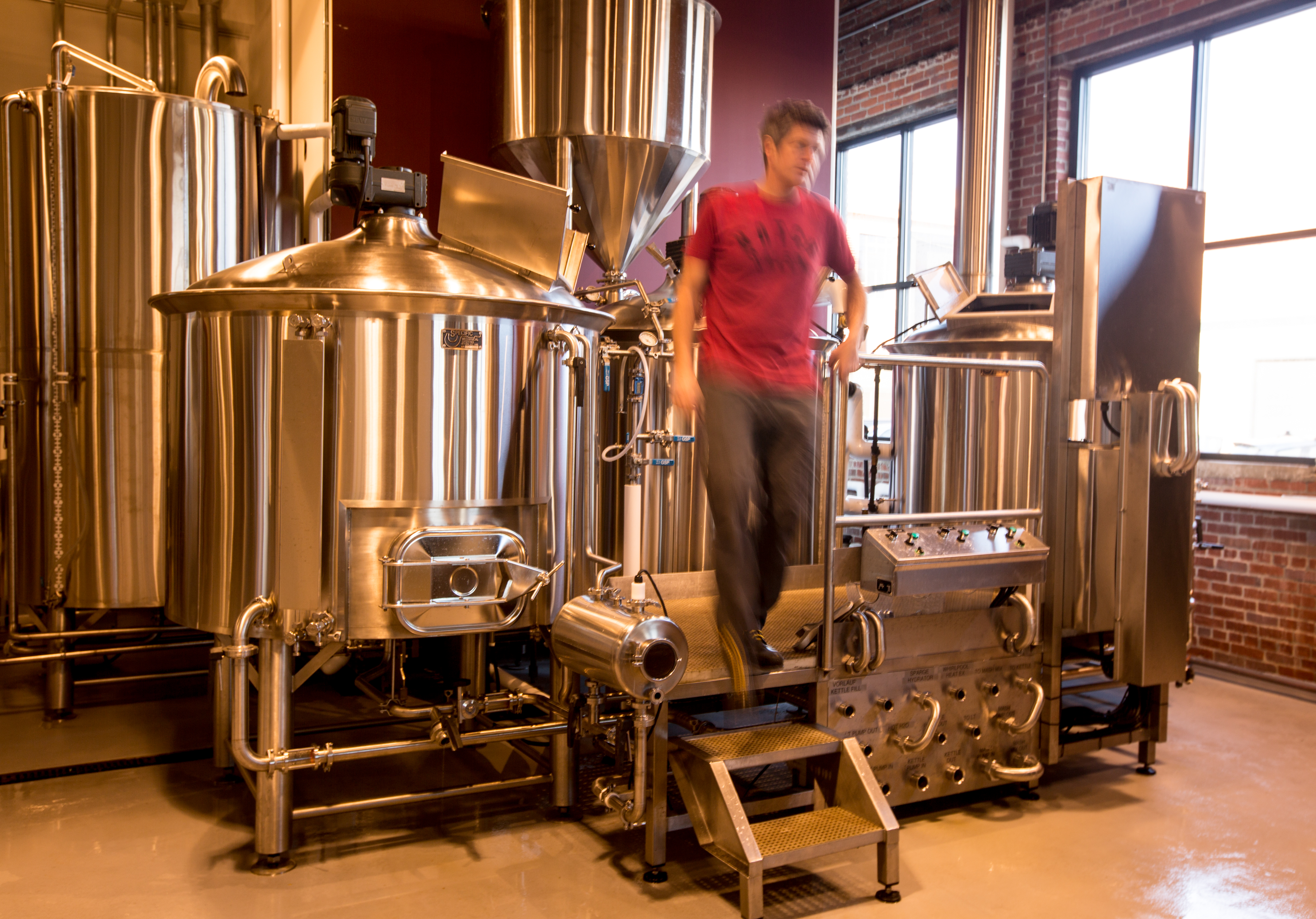 Chris Lohring, founder of Notch Brewing in Salem, doing maintenance work.