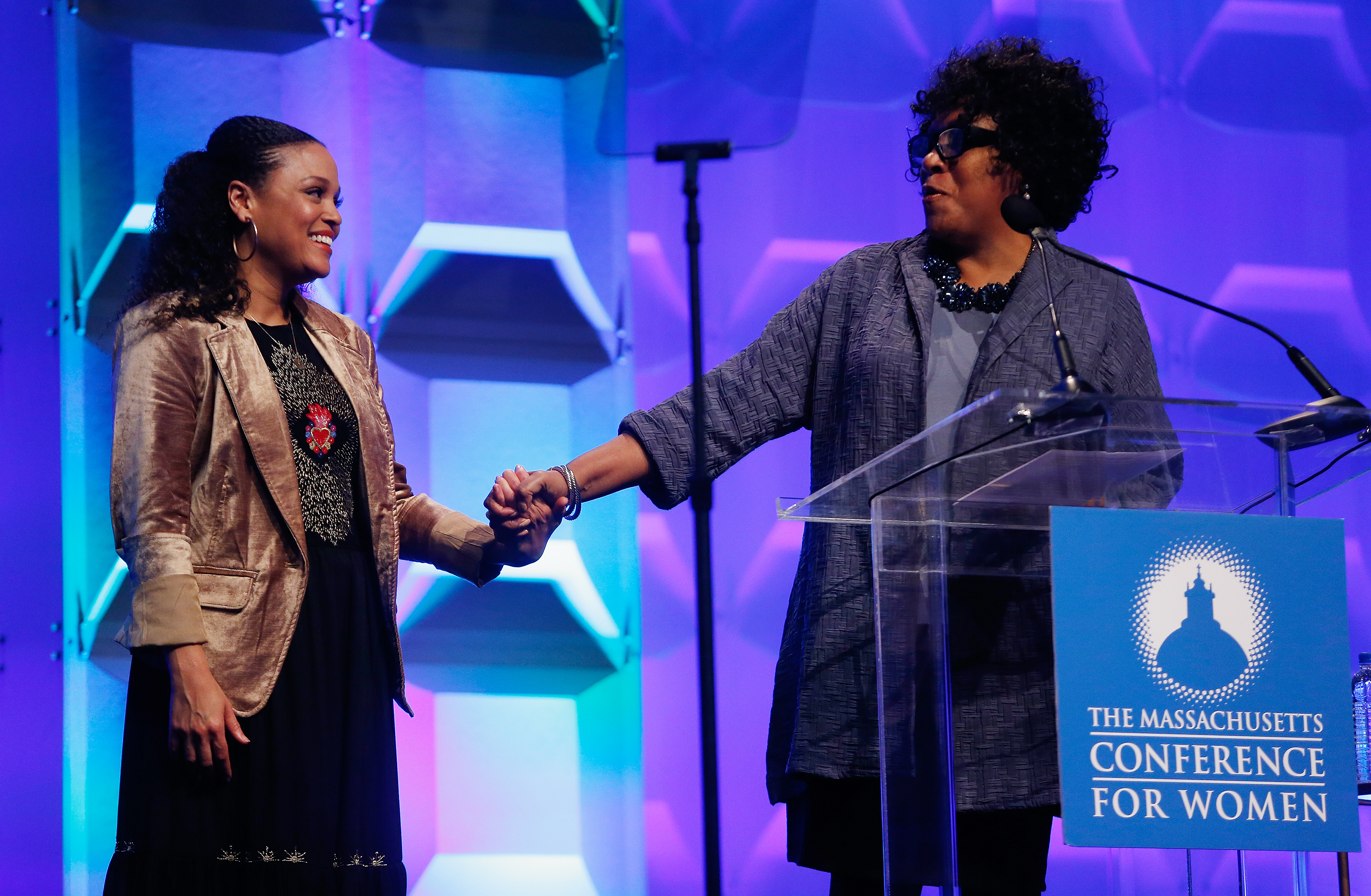 Author Jesmyn Ward (left) held hands with Karen Holmes Ward of Channel 5.
