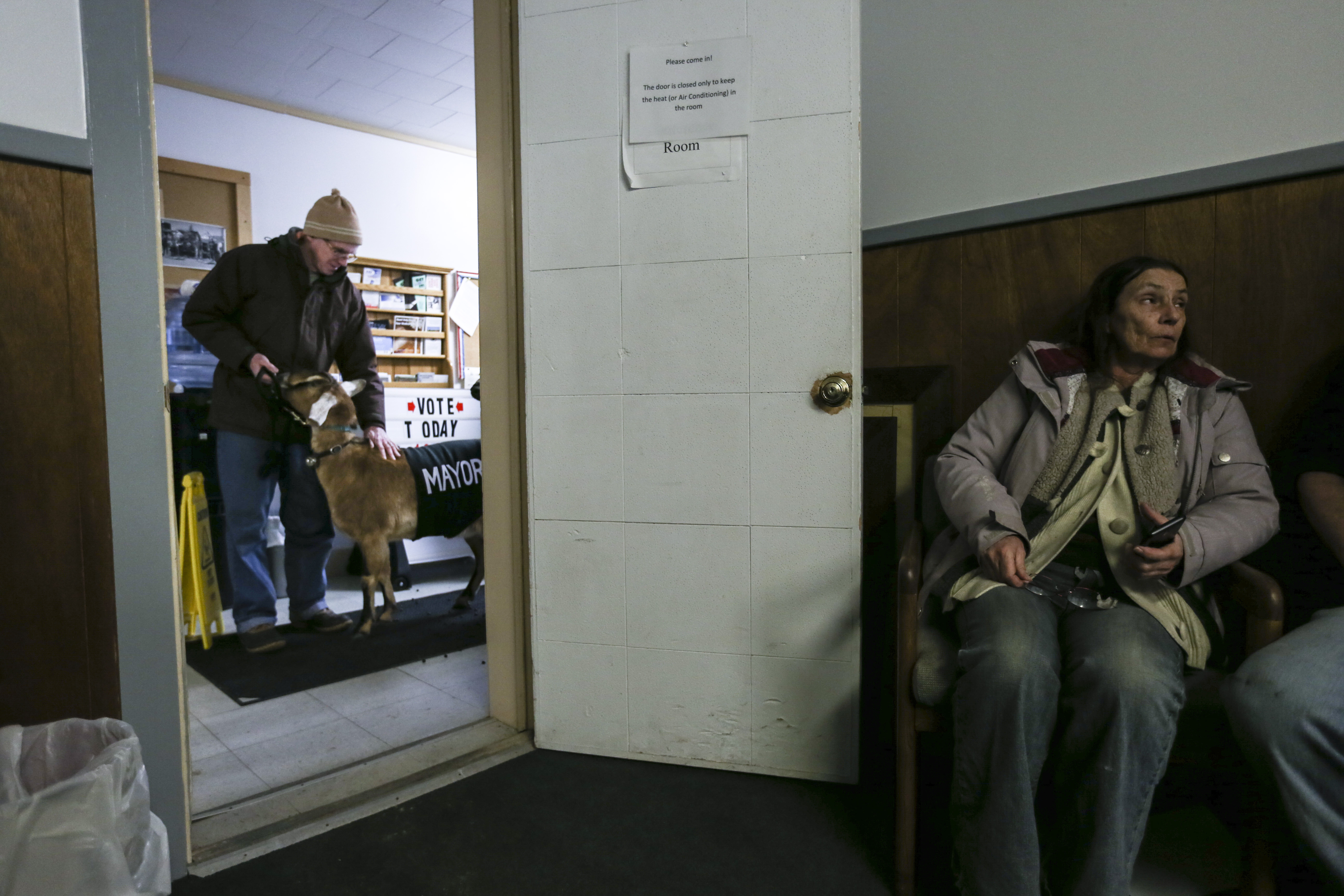Chris Stanton and Lincoln prepared to walk into a room in the Fair Haven Municipal Building for a ceremony to be sworn in as mayor.