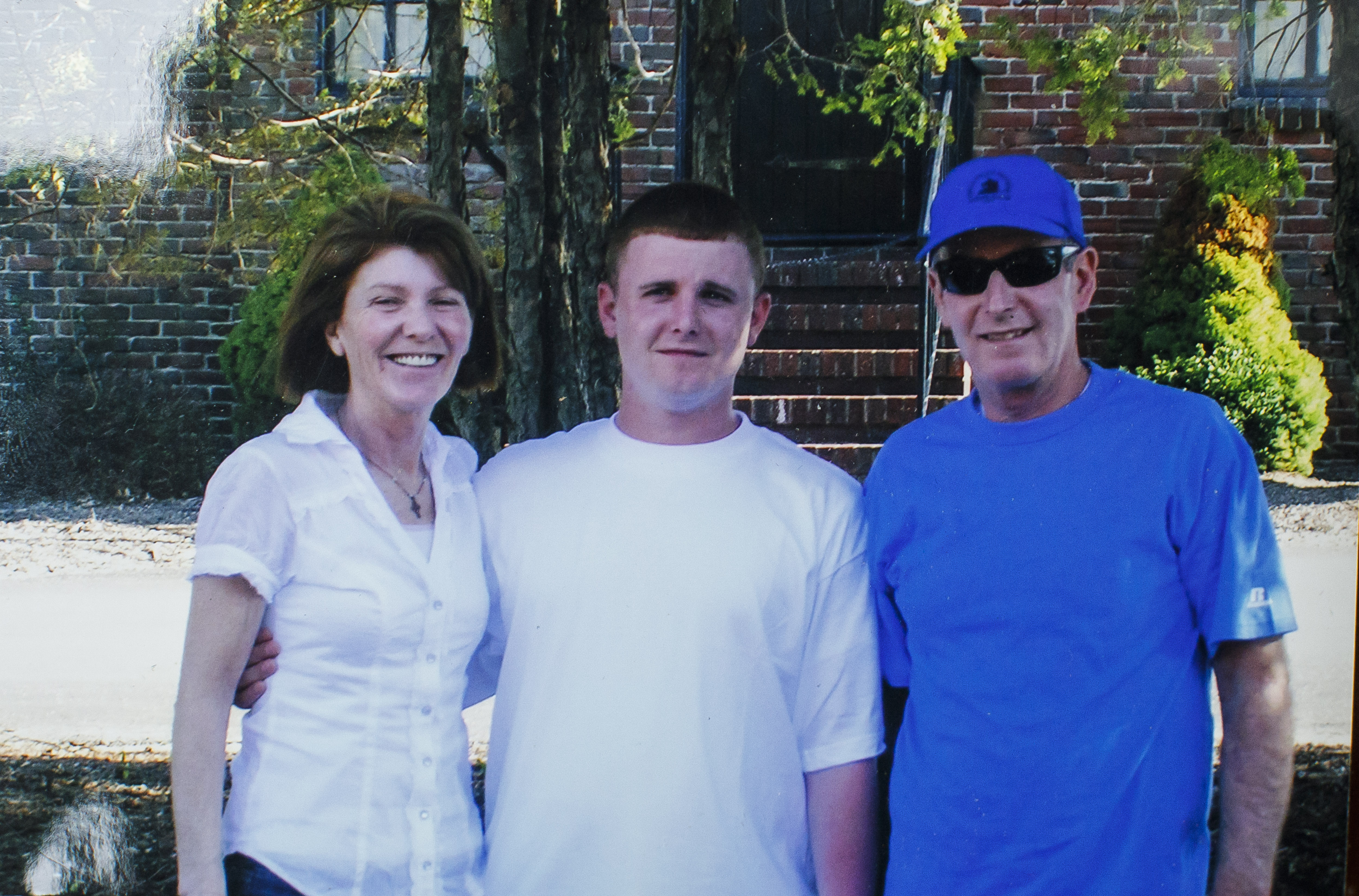 Maureen and Jack Graney, with their son Patrick, in a copy of a photo in their Milton home. Patrick Graney died after being sent to a rehab facility in Florida.