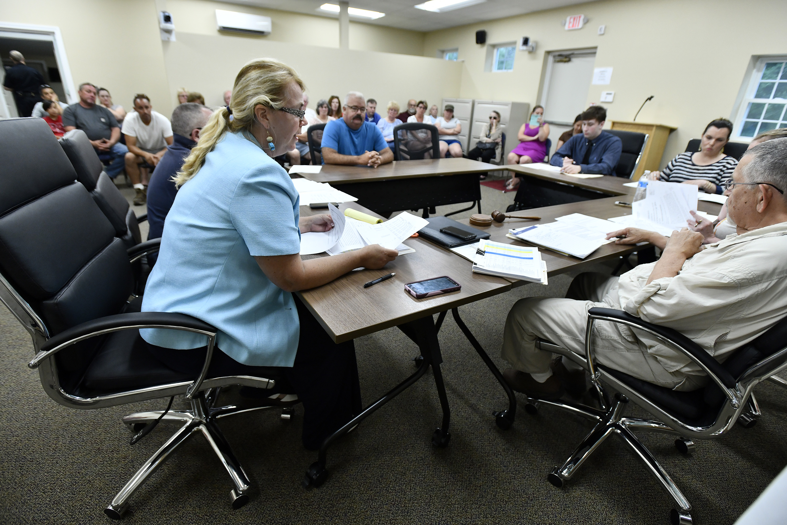 Town Administrator Jennifer Callahan described cuts to town services during a meeting.