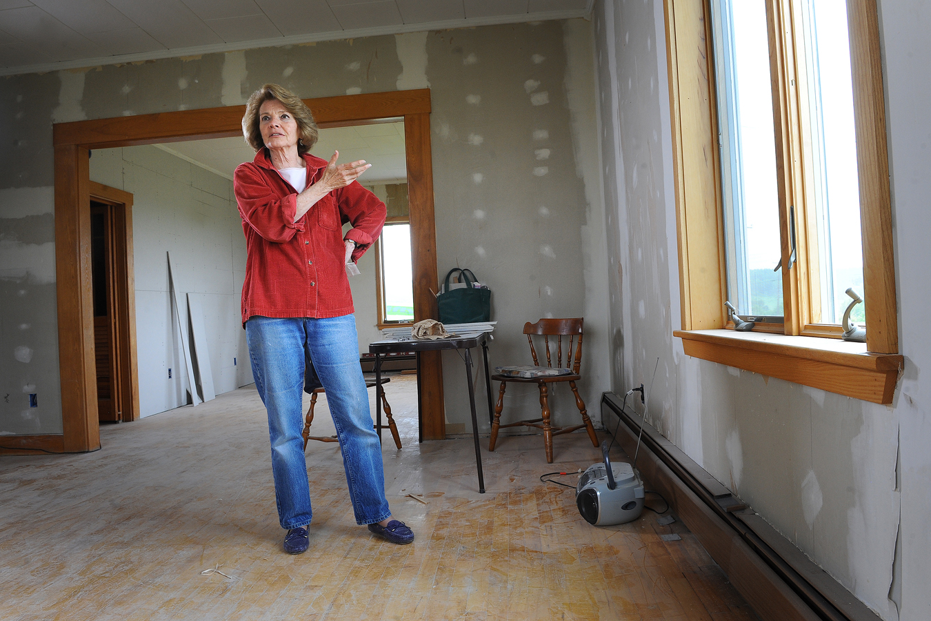 Christina Shipps stands in what would be the dining room of a new cafe she was creating in Patten, Maine.