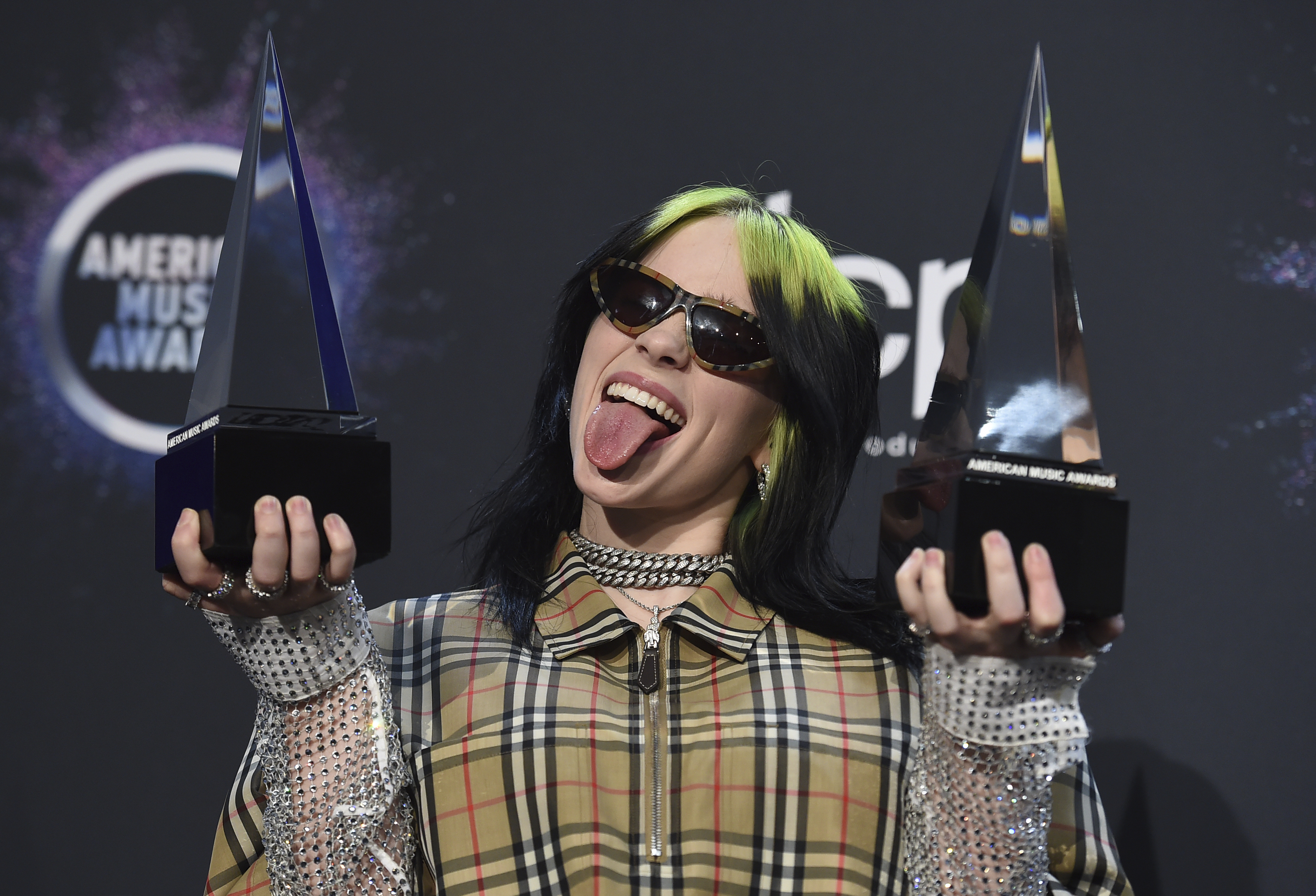 Billie Eilish posed with her awards Sunday after the AMAs.