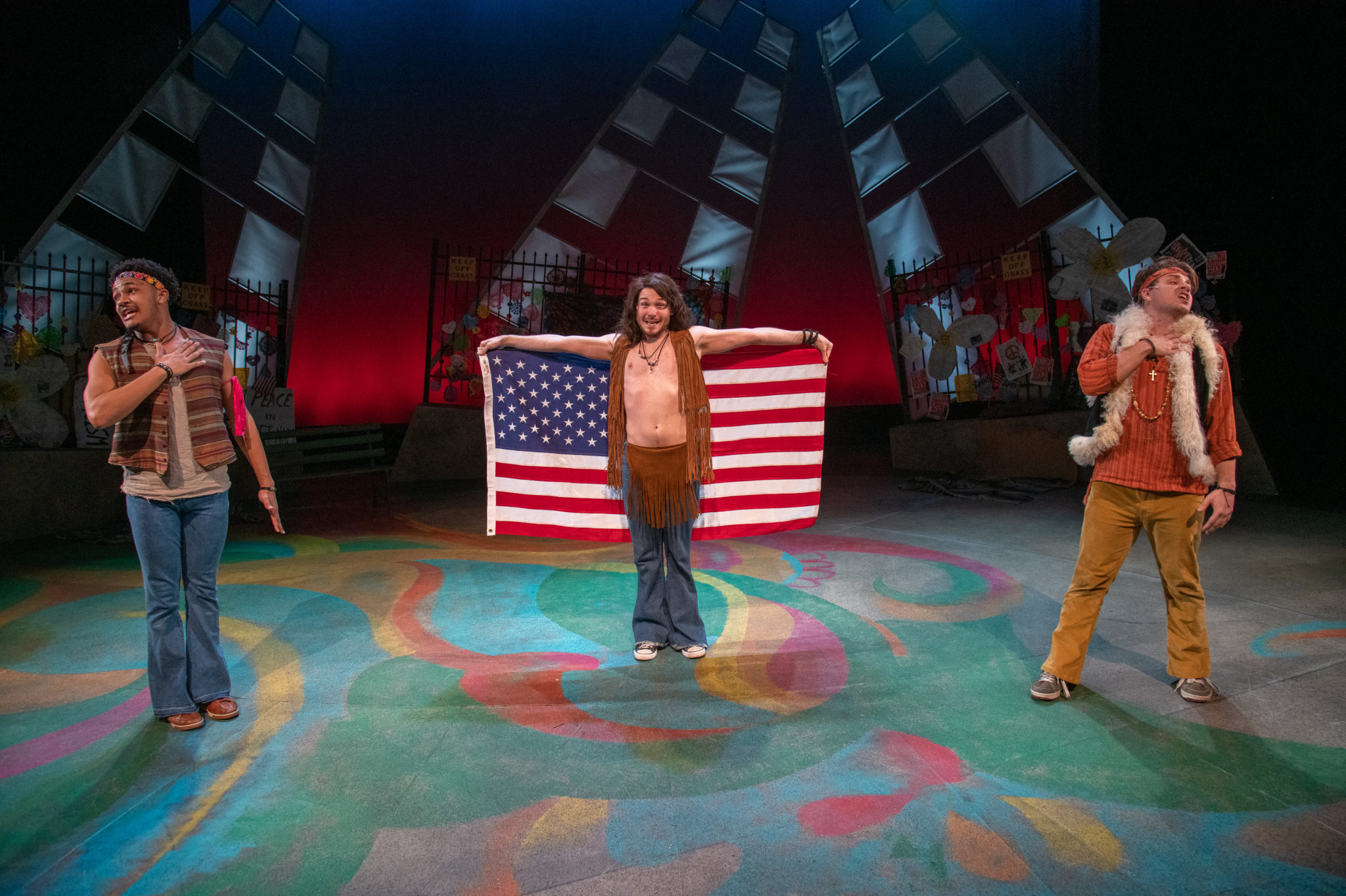 From left: Aaron Patterson, Eddie Shields, and Brian-Barry Pereira in "Hair" at New Repertory Theatre.