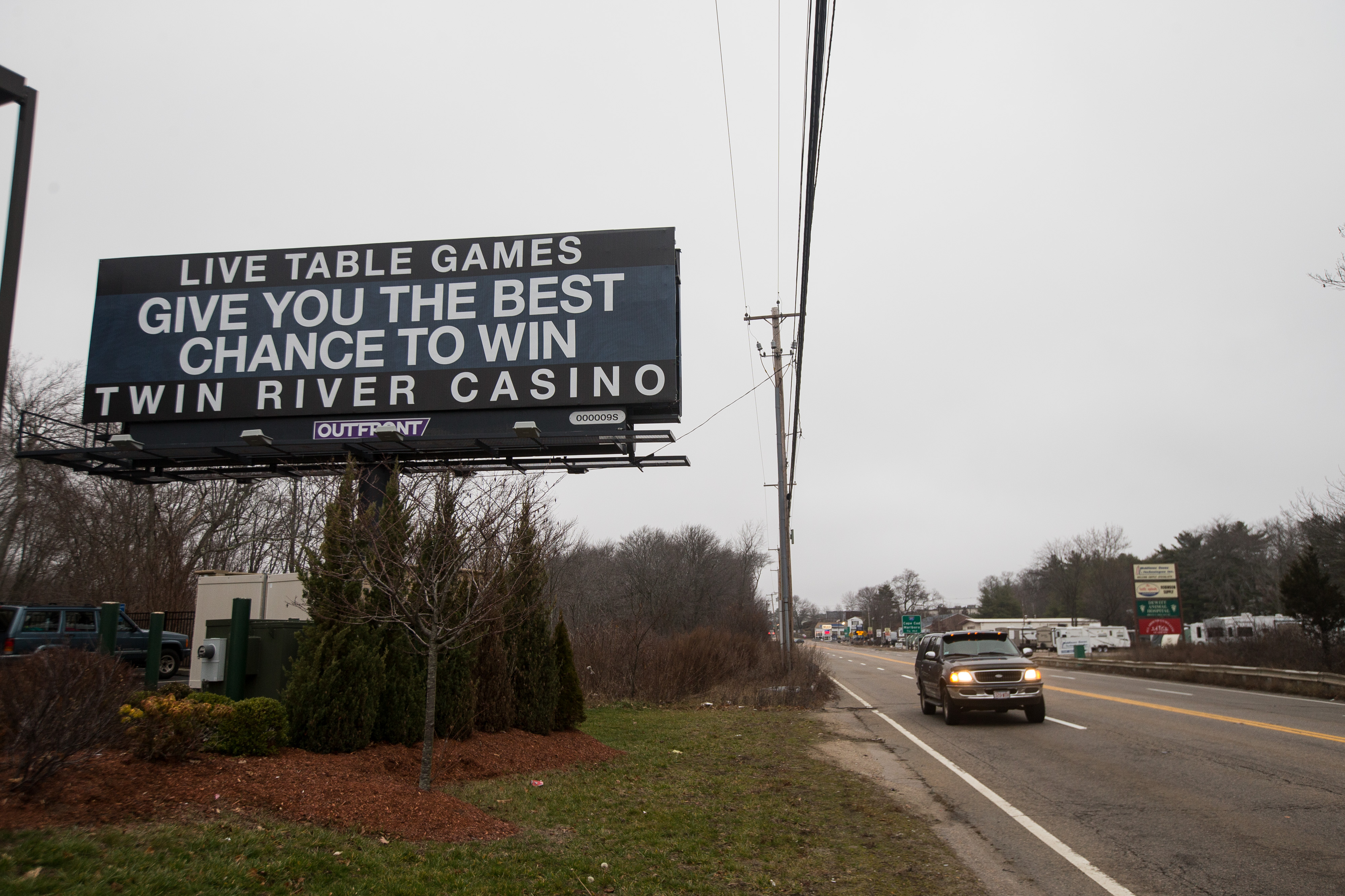 A billboard advertised for the Twin River Casino a half mile from the Plainridge Casino in Plainville, Mass.