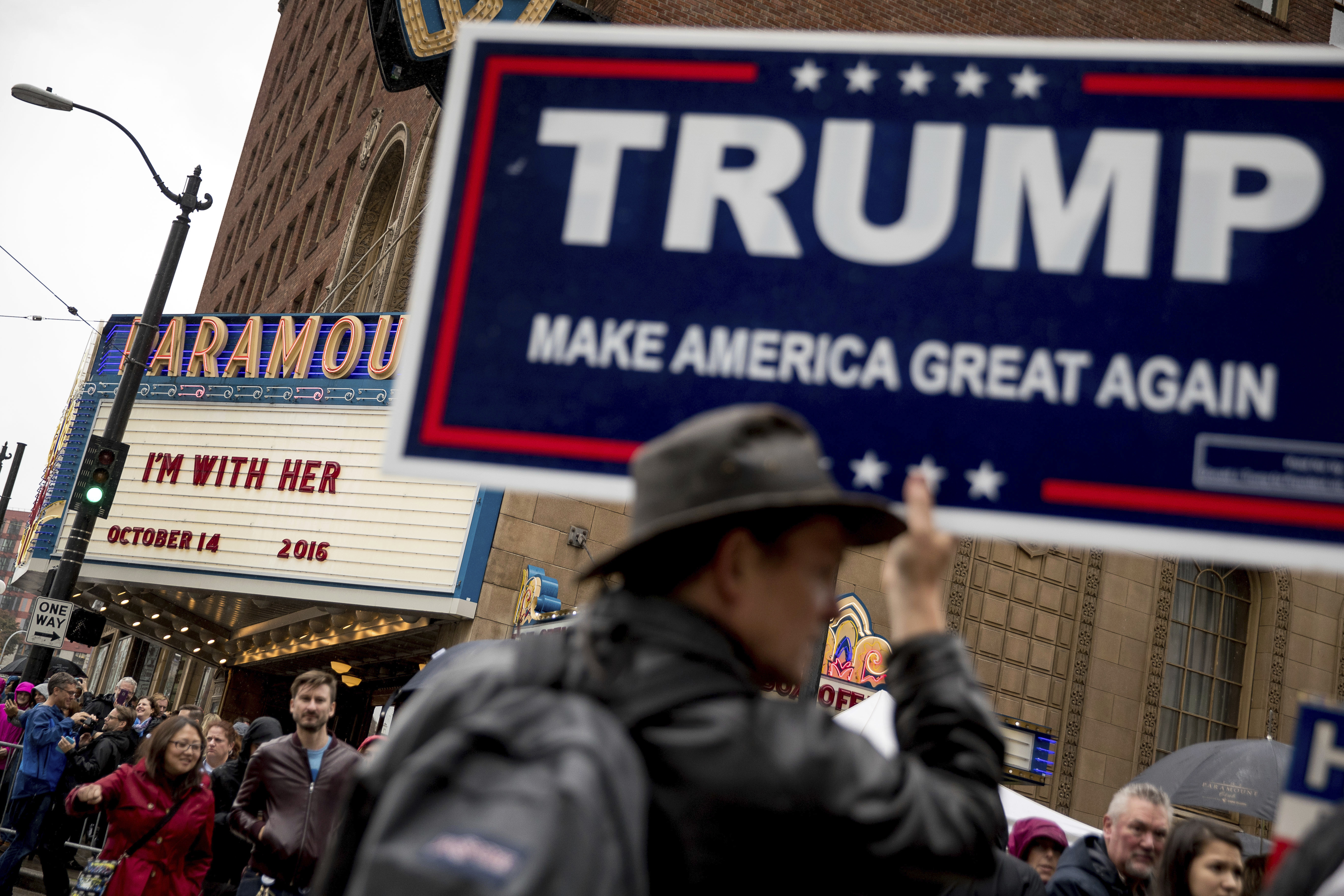 Supporters for Republican presidential candidate Donald Trump stood outside as people left after Democratic presidential candidate Hillary Clinton spoke in Seattle.
