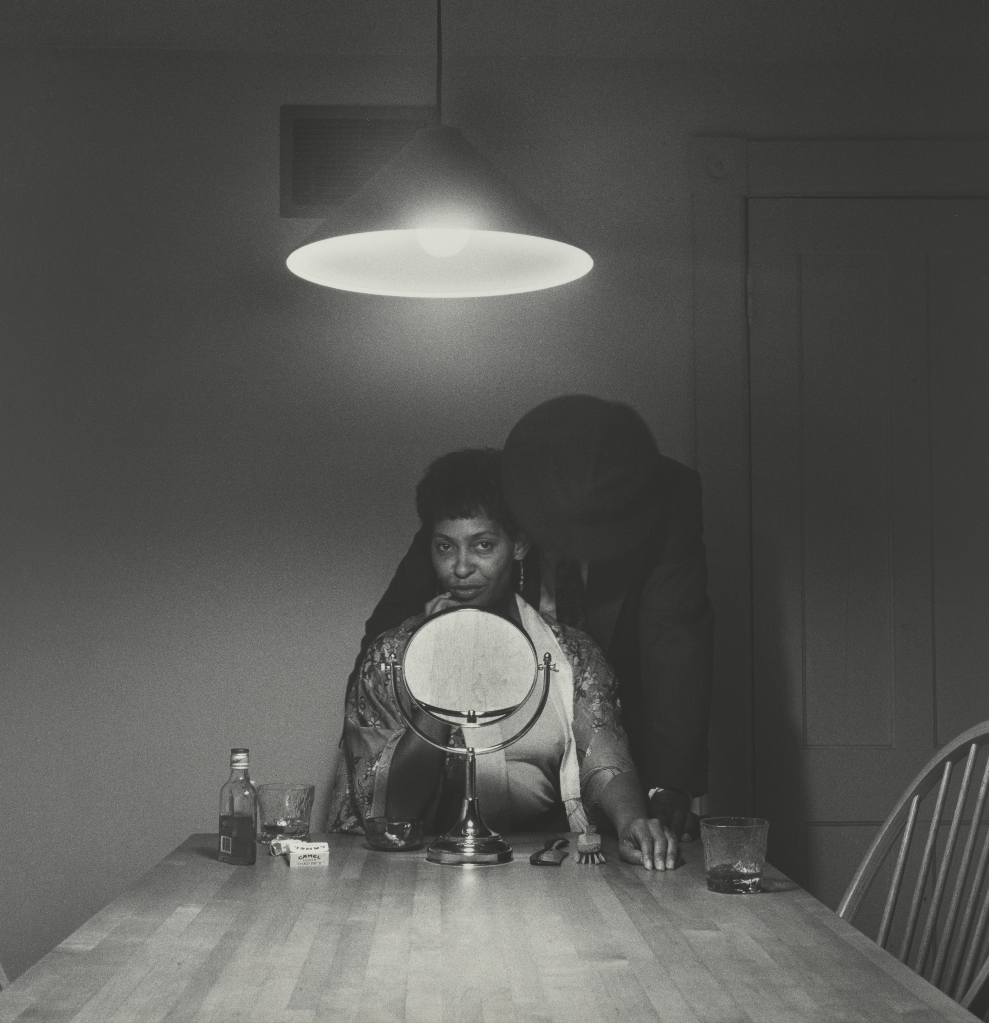 “Untitled (Man and mirror)’’ from Weems’s “Kitchen Table Series.”