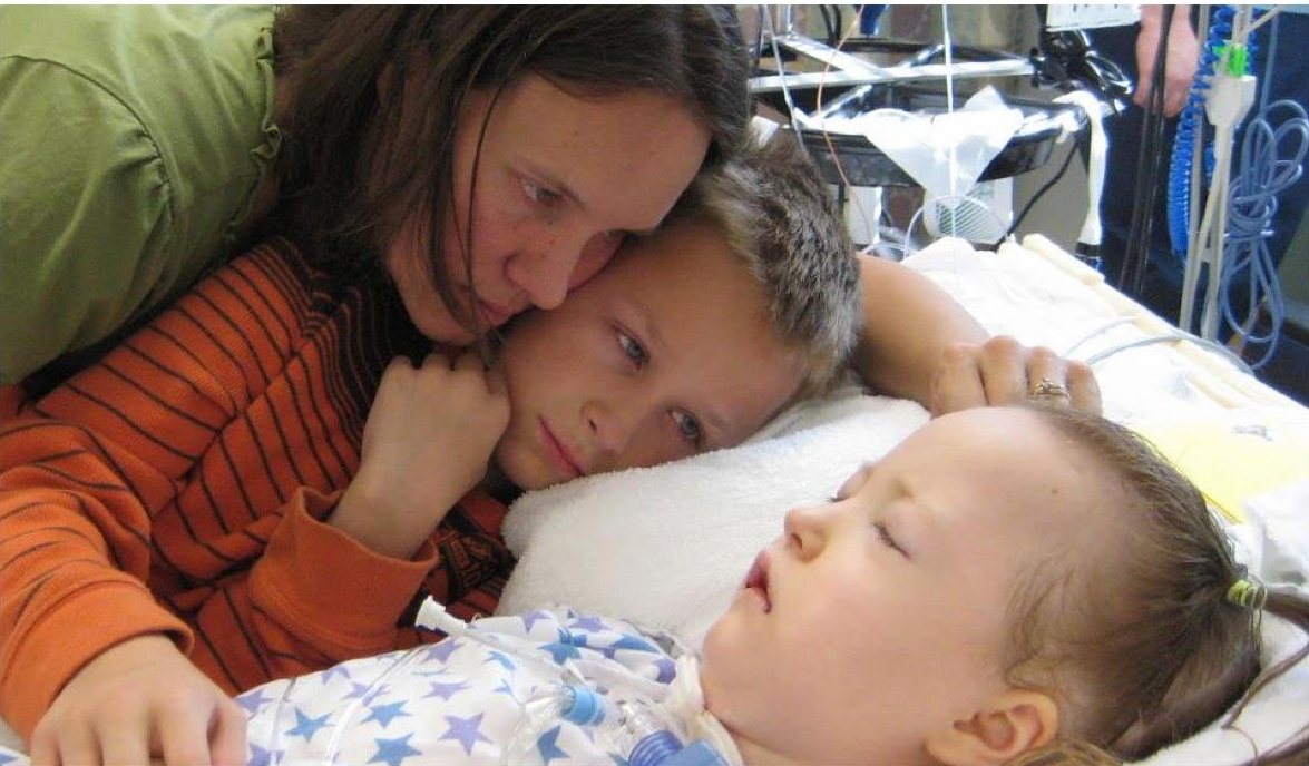 This 2012 photo released by the English family was taken as they were preparing to take Tabitha off life support. The family took her siblings to the hospital to say goodbye to their sister.