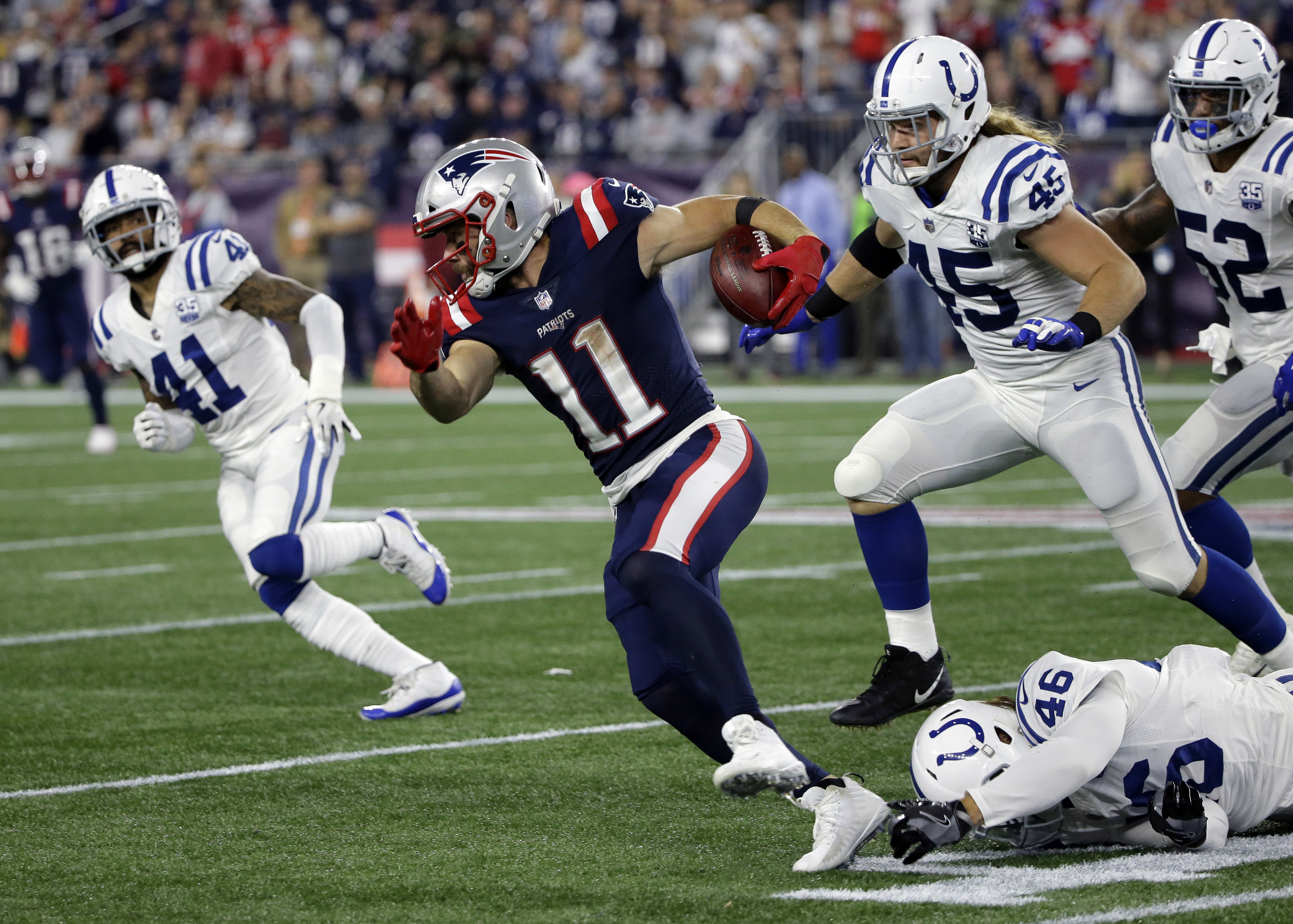 Julian Edelman returns a punt in the Patriots’ win over the Colts Thursday night.