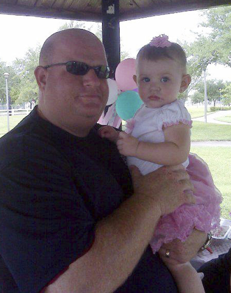 Aaron Feis (left) with an unidentified girl.