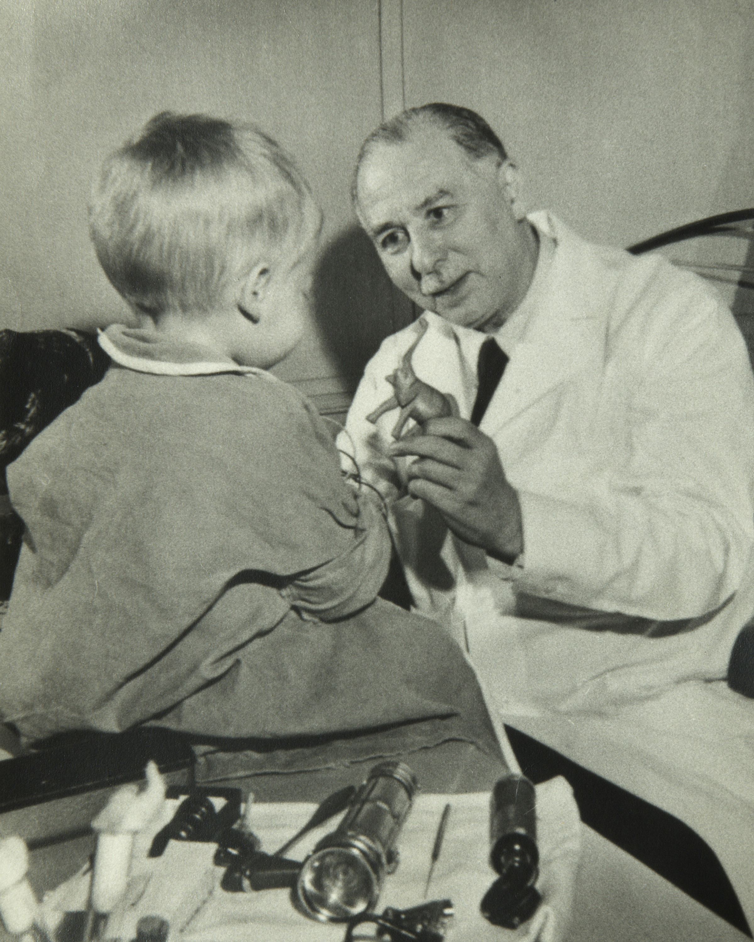 Sidney Farber with a child.