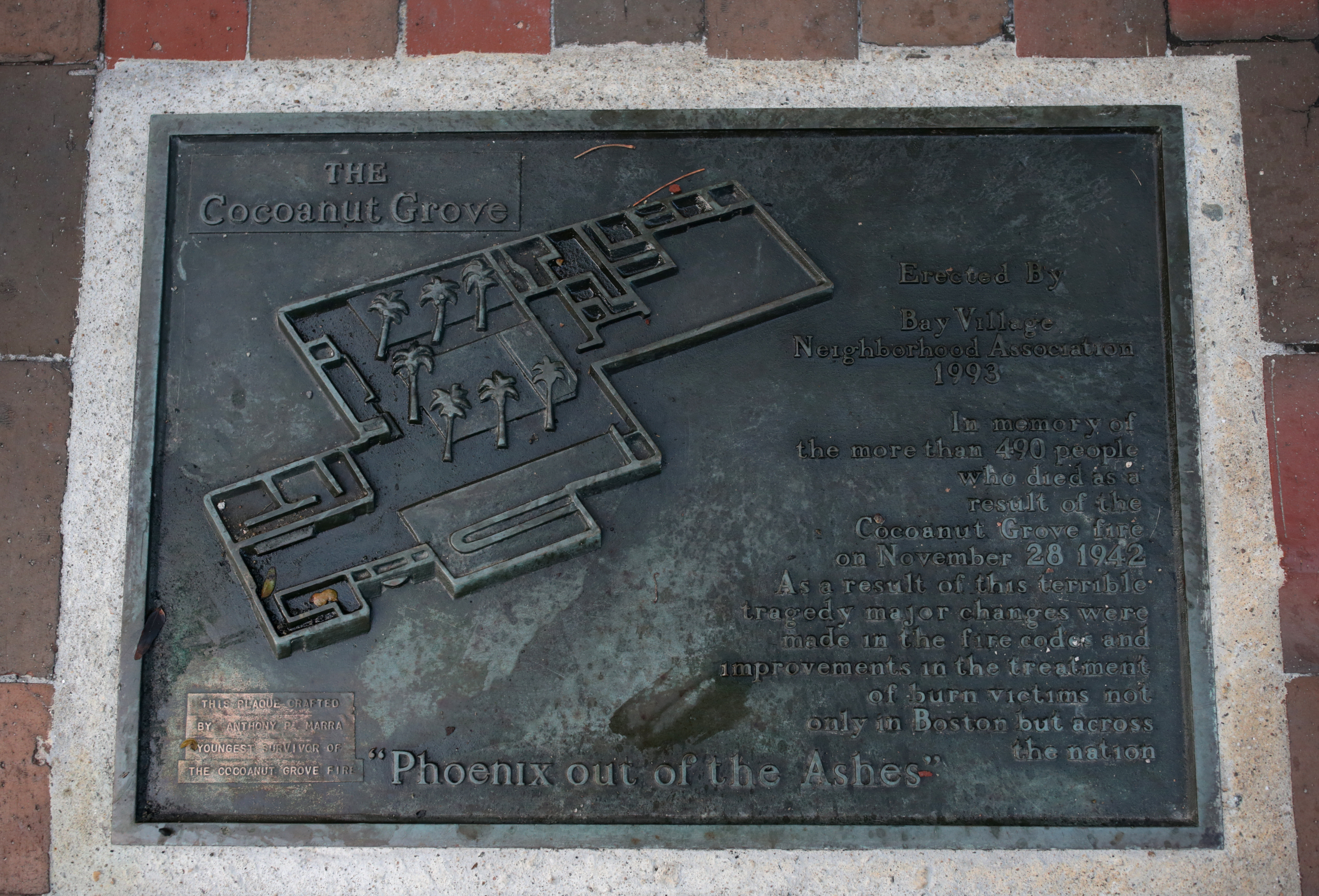 A plaque honors the 492 people killed in the fire.